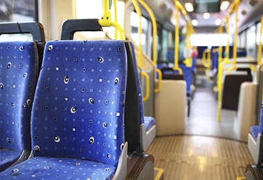 Empty bus with blue seat covers