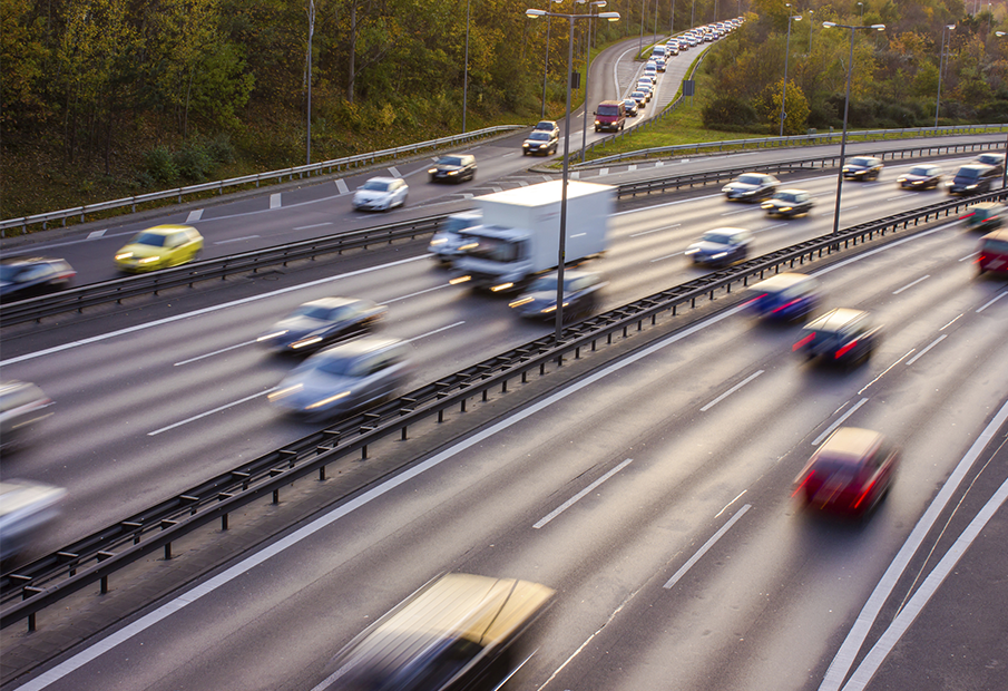 Cars zipping by on the highway