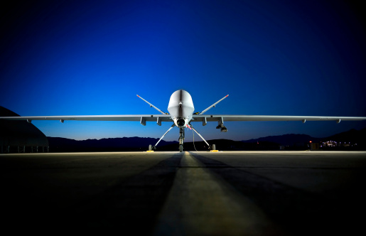 An MQ-9 Reaper sits on the flightline.
