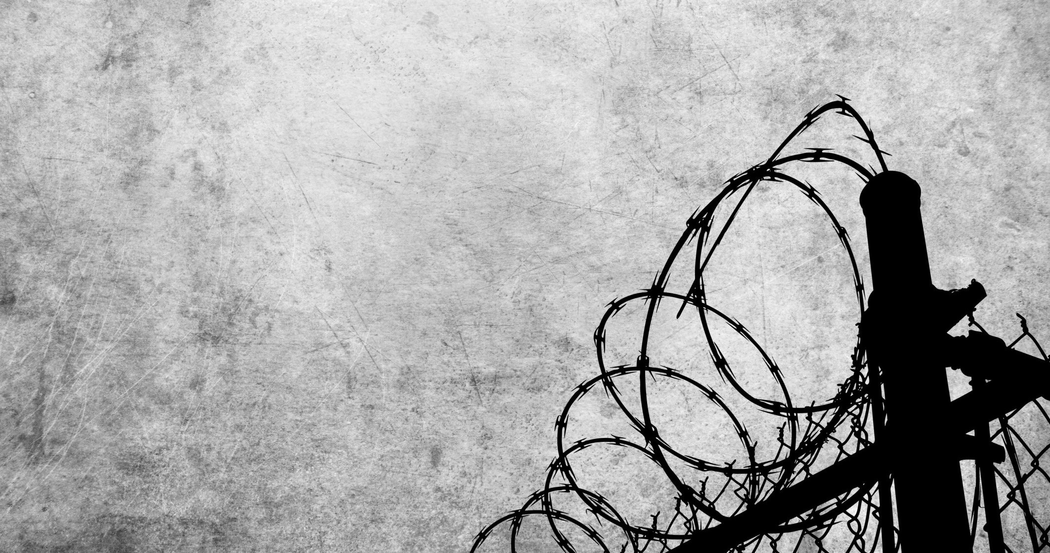 Grunge background with barbed wire fence