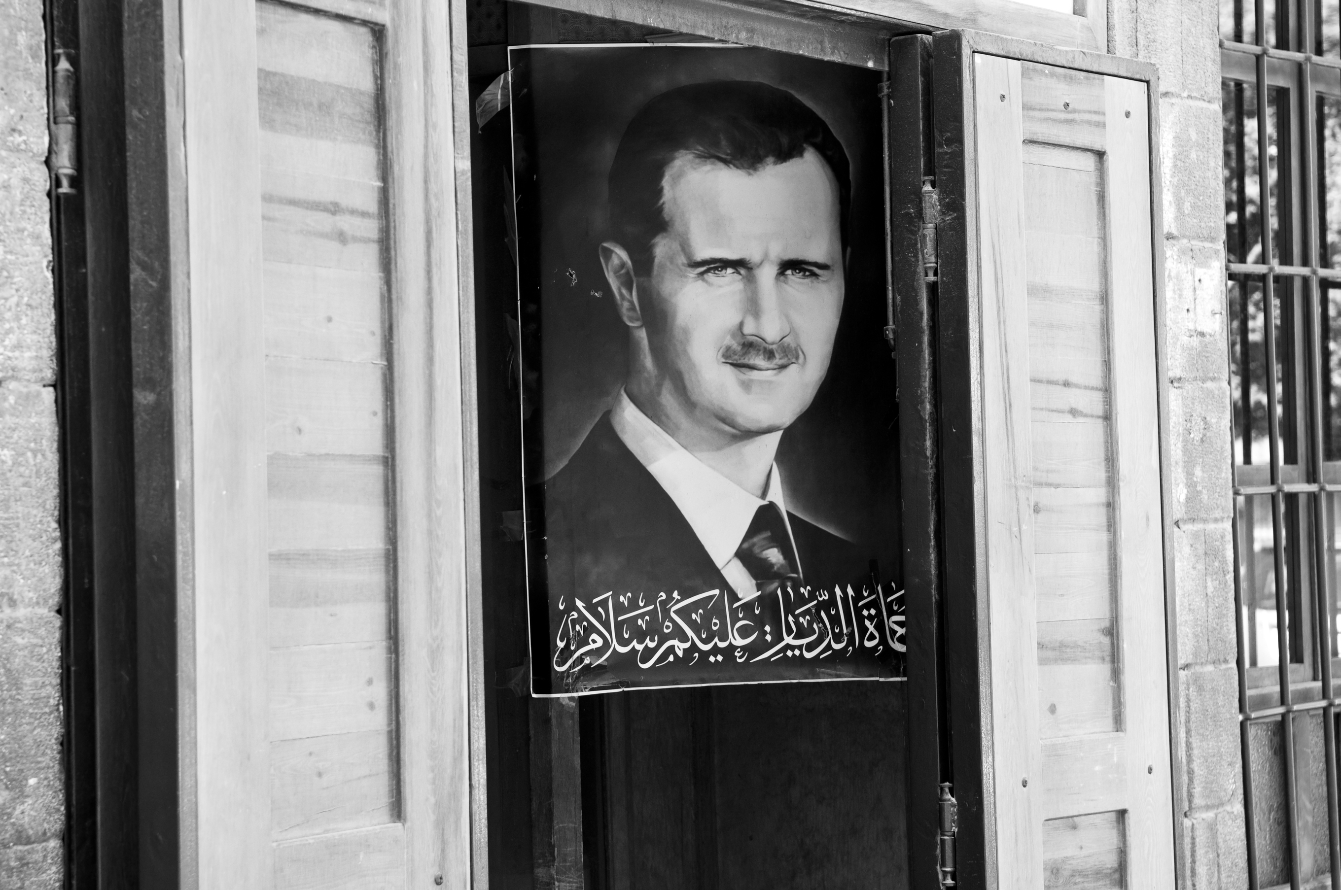 Damascus, Syria - June 15, 2010: A poster of Syrian President Bashar al-Assad hangs outside a shop in central Damascus.