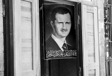 Damascus, Syria - June 15, 2010: A poster of Syrian President Bashar al-Assad hangs outside a shop in central Damascus.