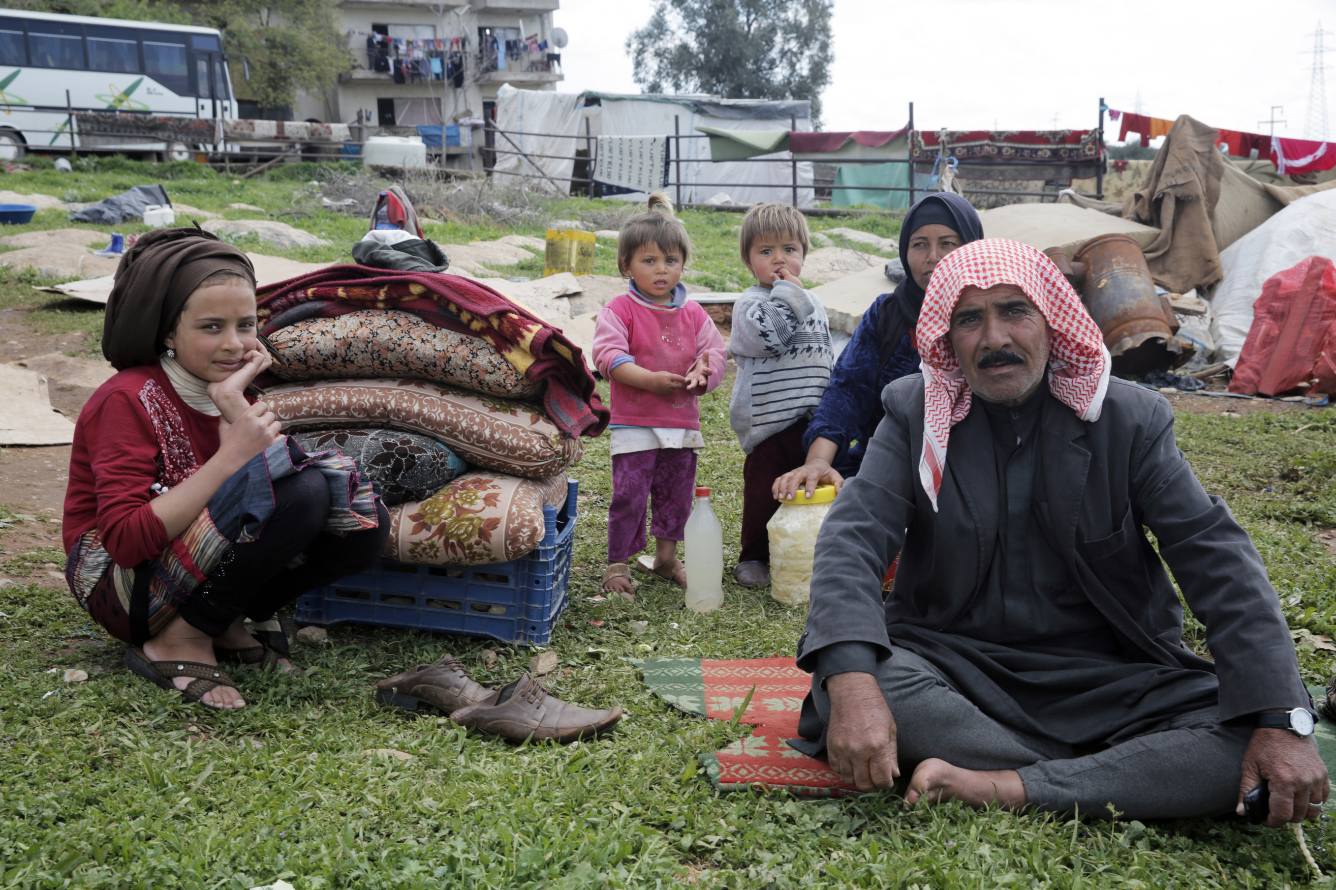 Izmir, Turkey - March 11, 2016: A Syrian family in refugee camp in Izmir,Turkey. These people are refugees from Haleppo and escaped because of Syrian war.