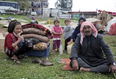 Izmir, Turkey - March 11, 2016: A Syrian family in refugee camp in Izmir,Turkey. These people are refugees from Haleppo and escaped because of Syrian war.