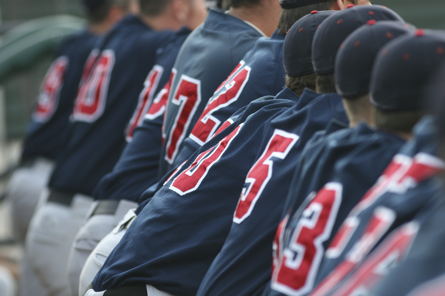 baseball teammates in the dugout