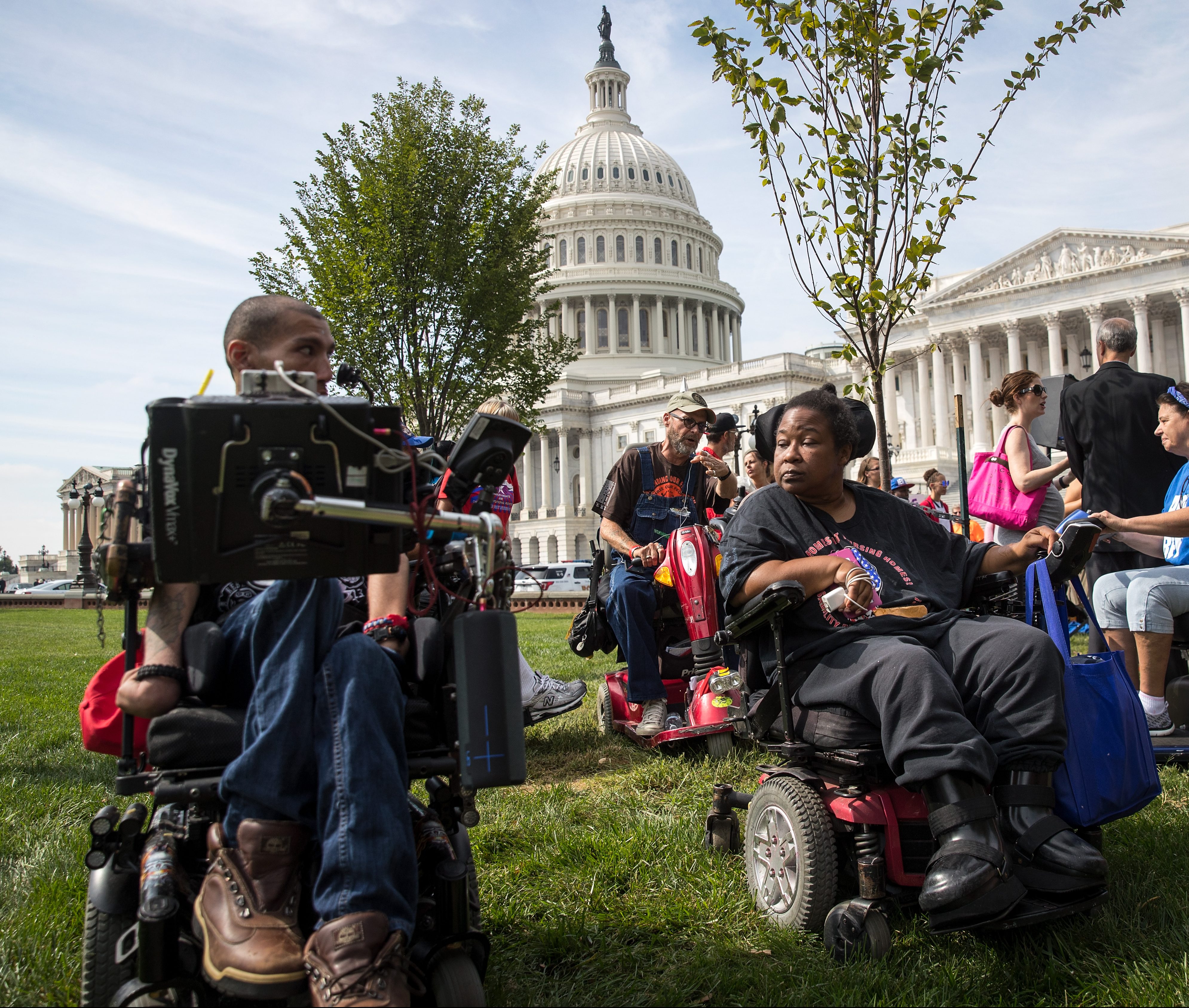 WASHINGTON, DC - SEPTEMBER 26: People in wheelchairs, from the group ADAPT, wait for senators to arrive for a news conference in opposition to the Graham-Cassidy health care bill, September 26, 2017 in Washington, DC. The Graham-Cassidy bill, the GOP's latest effort to repeal the Affordable Care Act (ACA), is in peril after Sen. Susan Collins (R-ME) announced her opposition to the bill on Monday night. (Photo by Drew Angerer/Getty Images)