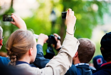 New York, USA  - May 1, 2012: People making photos and videos in a crowd of protestants during peaceful demonstration May 1st on Union Square, New York