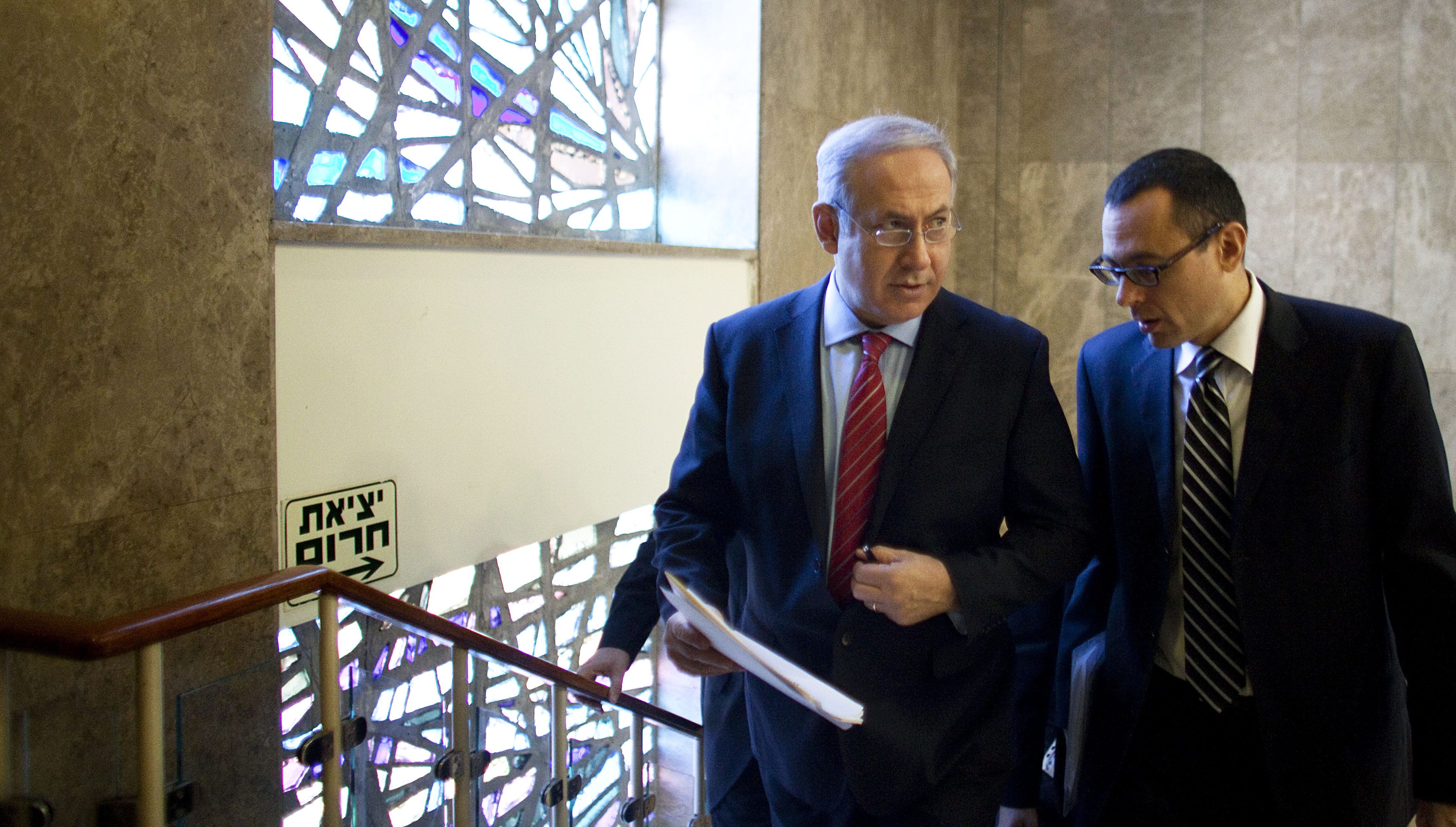 JERUSALEM, ISRAEL - NOVEMBER 14:  (ISRAEL OUT) Israeli Prime Minister Benjamin Netanyahu (L) walks up stairs to his Jerusalem offices for the weekly cabinet meeting on November 14, 2010 in Jerusalem, Israel. Netanyahu will encourage his cabinet to cease construction in the West Bank and will negotiate receiving three billion dollars worth in security incentives in return for signing a peace agreement with the Palestinians.  (Photo by Uriel Sinai/Getty Images)