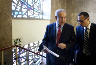 JERUSALEM, ISRAEL - NOVEMBER 14:  (ISRAEL OUT) Israeli Prime Minister Benjamin Netanyahu (L) walks up stairs to his Jerusalem offices for the weekly cabinet meeting on November 14, 2010 in Jerusalem, Israel. Netanyahu will encourage his cabinet to cease construction in the West Bank and will negotiate receiving three billion dollars worth in security incentives in return for signing a peace agreement with the Palestinians.  (Photo by Uriel Sinai/Getty Images)