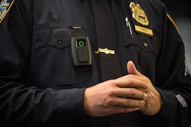 NEW YORK, NY - DECEMBER 03:  New York Police Department (NYPD) Sergeant Joseph Freer demonstrates how to use and operate a body camera during a media press conference on December 3, 2014 in New York City. The NYPD is beginning a trial exploring the use of body cameras; starting Friday NYPD officers in three different precincts will begin wearing body cameras during their patrols.  (Photo by Andrew Burton/Getty Images)