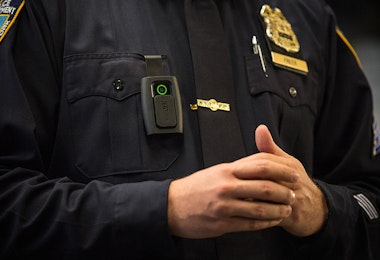 NEW YORK, NY - DECEMBER 03:  New York Police Department (NYPD) Sergeant Joseph Freer demonstrates how to use and operate a body camera during a media press conference on December 3, 2014 in New York City. The NYPD is beginning a trial exploring the use of body cameras; starting Friday NYPD officers in three different precincts will begin wearing body cameras during their patrols.  (Photo by Andrew Burton/Getty Images)