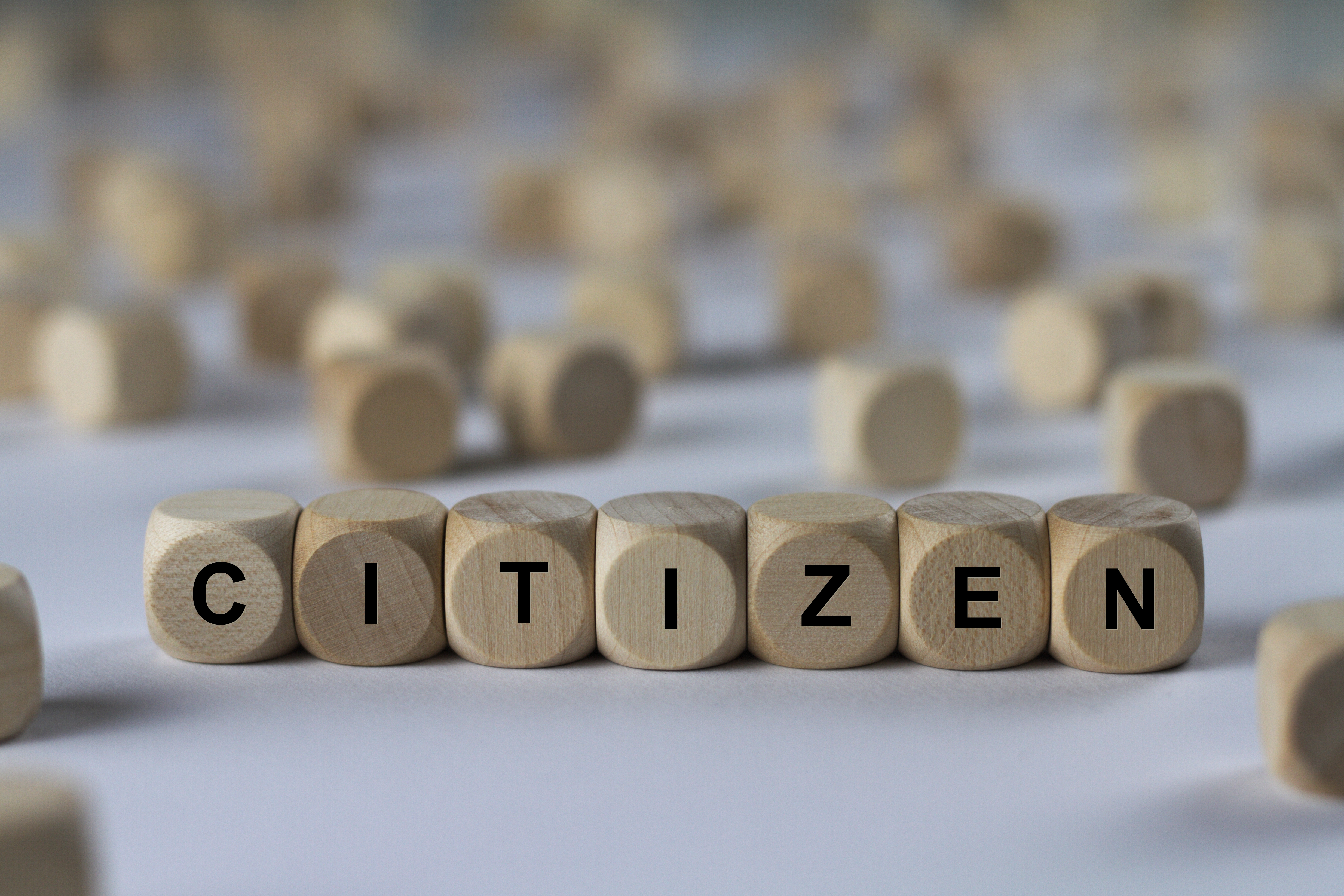 series of images: cube with letters, sign with wooden cubes