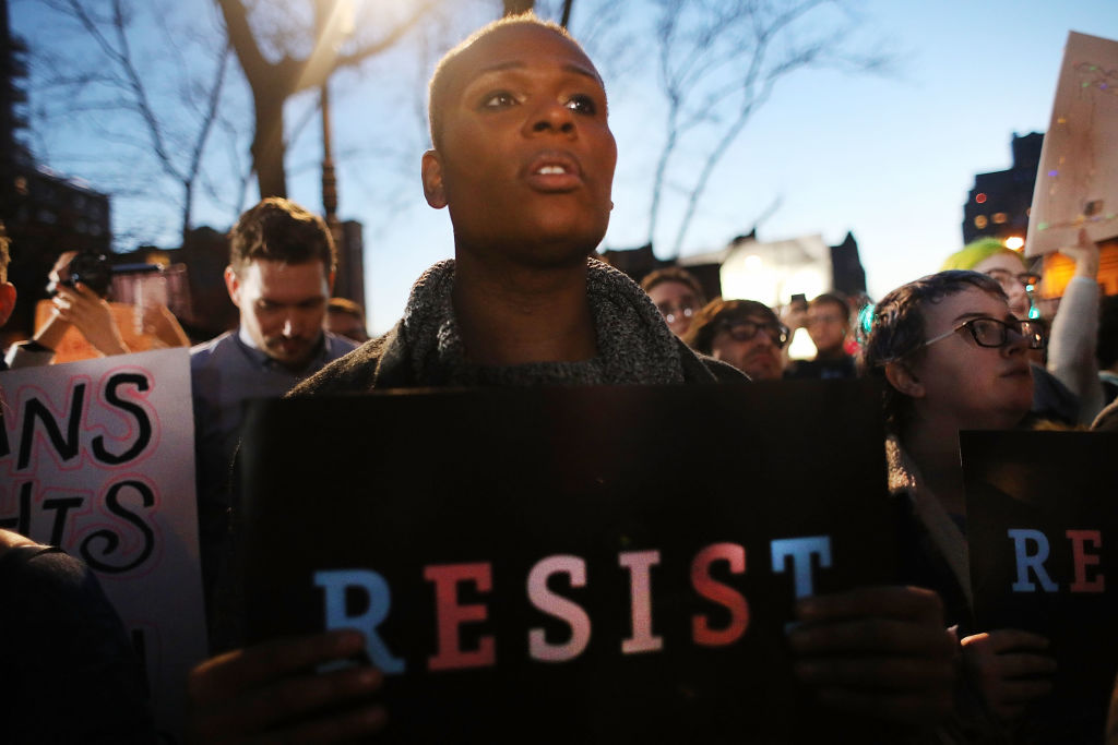 NEW YORK, NY - FEBRUARY 23:  Hundreds protest a Trump administration announcement this week that rescinds an Obama-era order allowing transgender students to use school bathrooms matching their gender identities, at the Stonewall Inn on February 23, 2017 in New York City. Activists and members of the transgender community gathered outside the historic LGTB bar to denounce the new policy.  (Photo by Spencer Platt/Getty Images)
