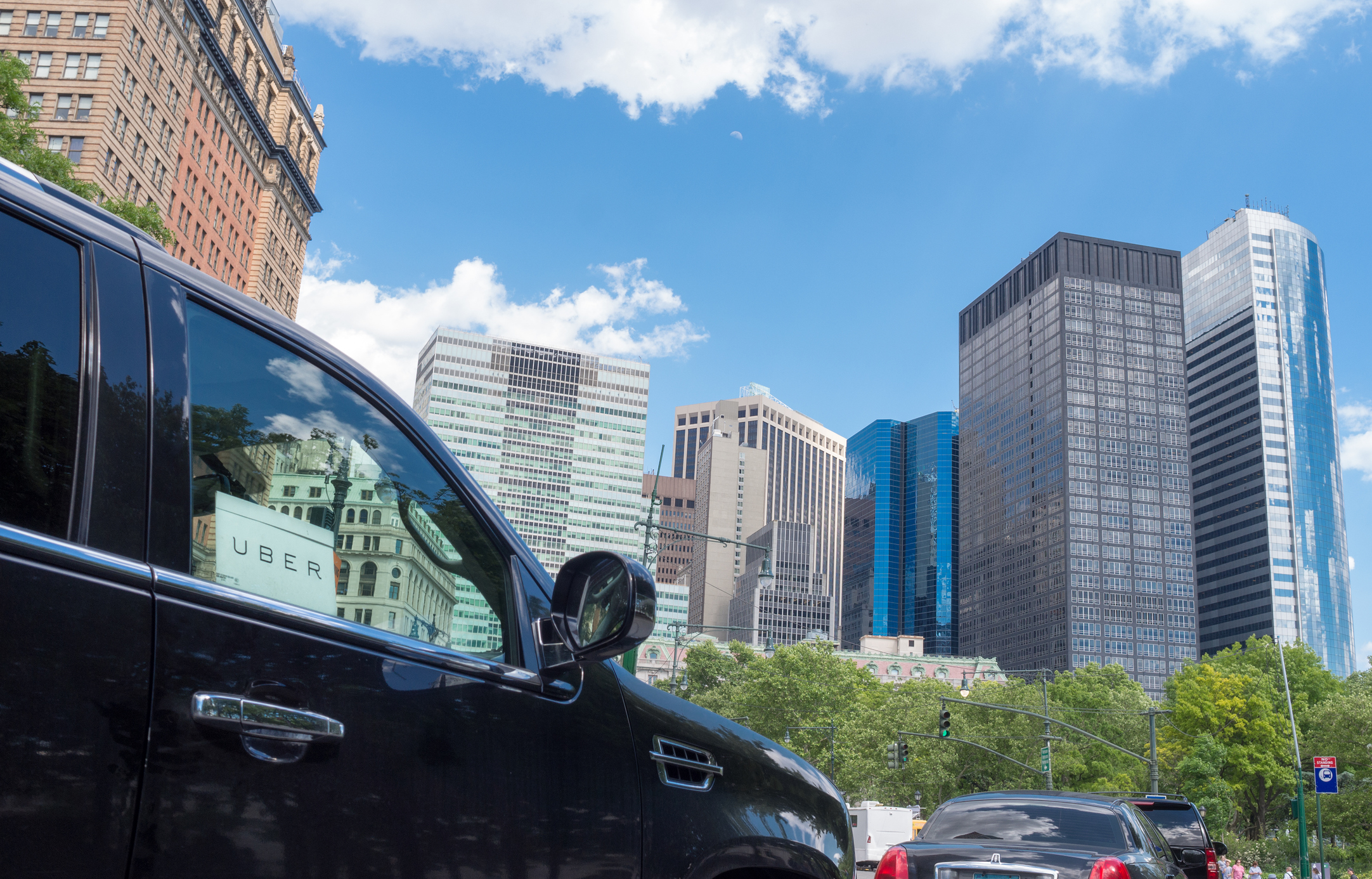 New York City, USA - June 1, 2017: Close up of Uber car service sign in car window.  Uber is a car service that clients call with the use of smartphone apps.