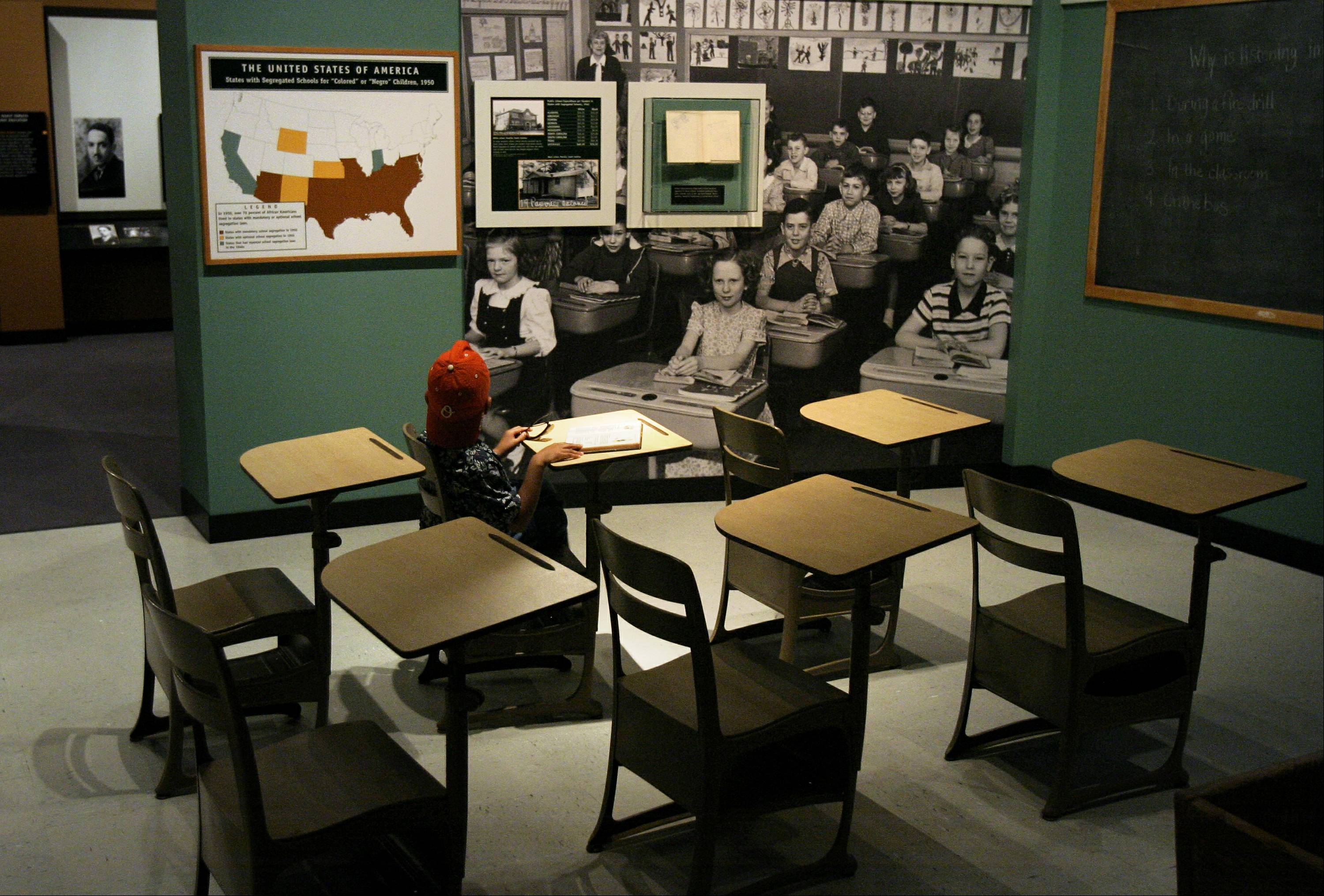 WASHINGTON - MAY 15:  Jordan Maclin, 6 of Maryland, sits in a Brown vs Board of Ed era classroom at the 