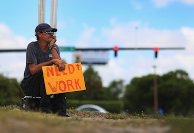 POMPANO BEACH, FL - JUNE 03: Stephen Greene works a street corner hoping to land a job as a laborer or carpenter on June 3, 2011 in Pompano Beach, Florida. Employers in May added 54,000 jobs the fewest in eight months, and the unemployment rate inched up to 9.1 percent. (Photo by Joe Raedle/Getty Images)