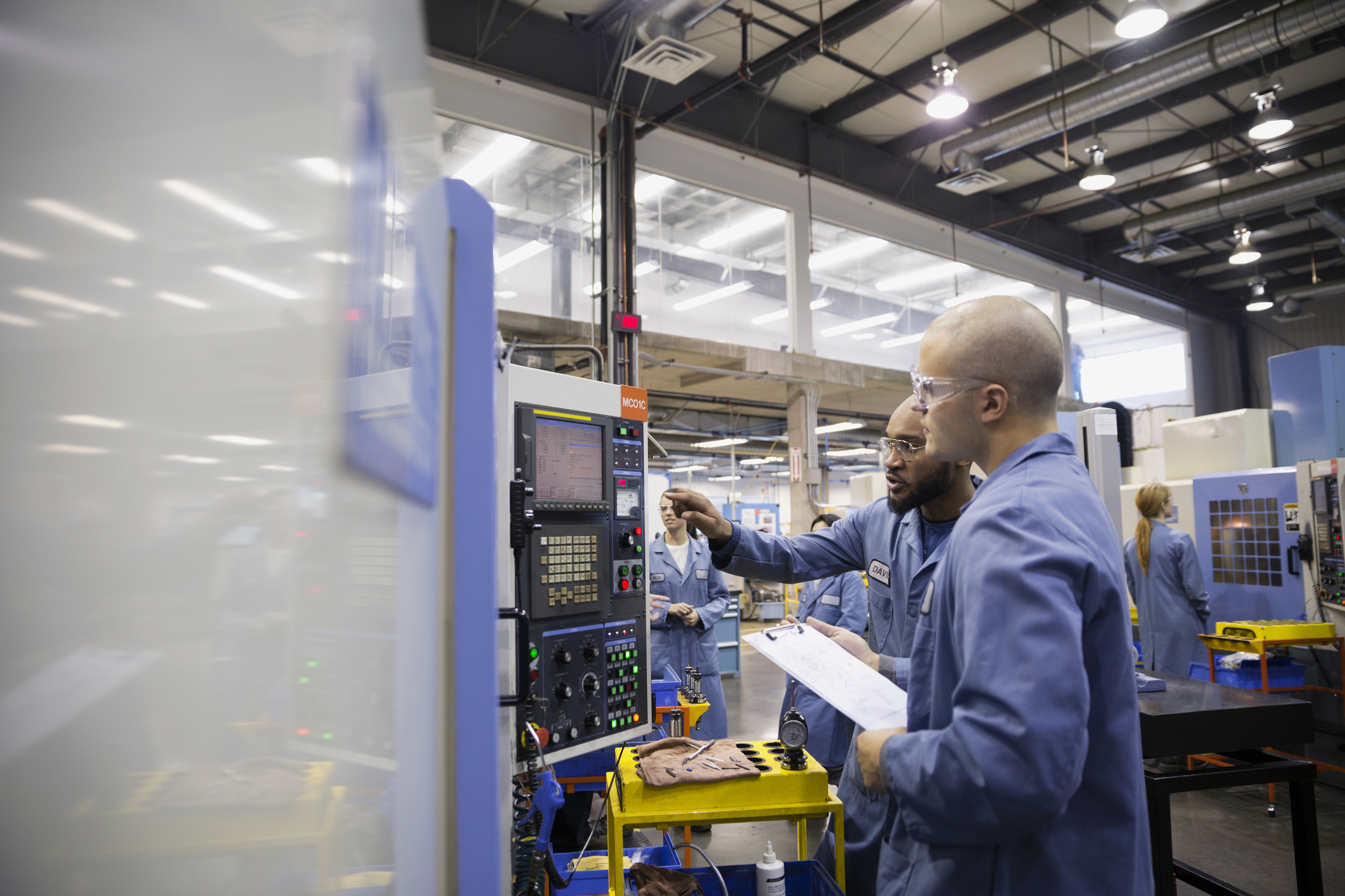 a man working on a machine in a factory