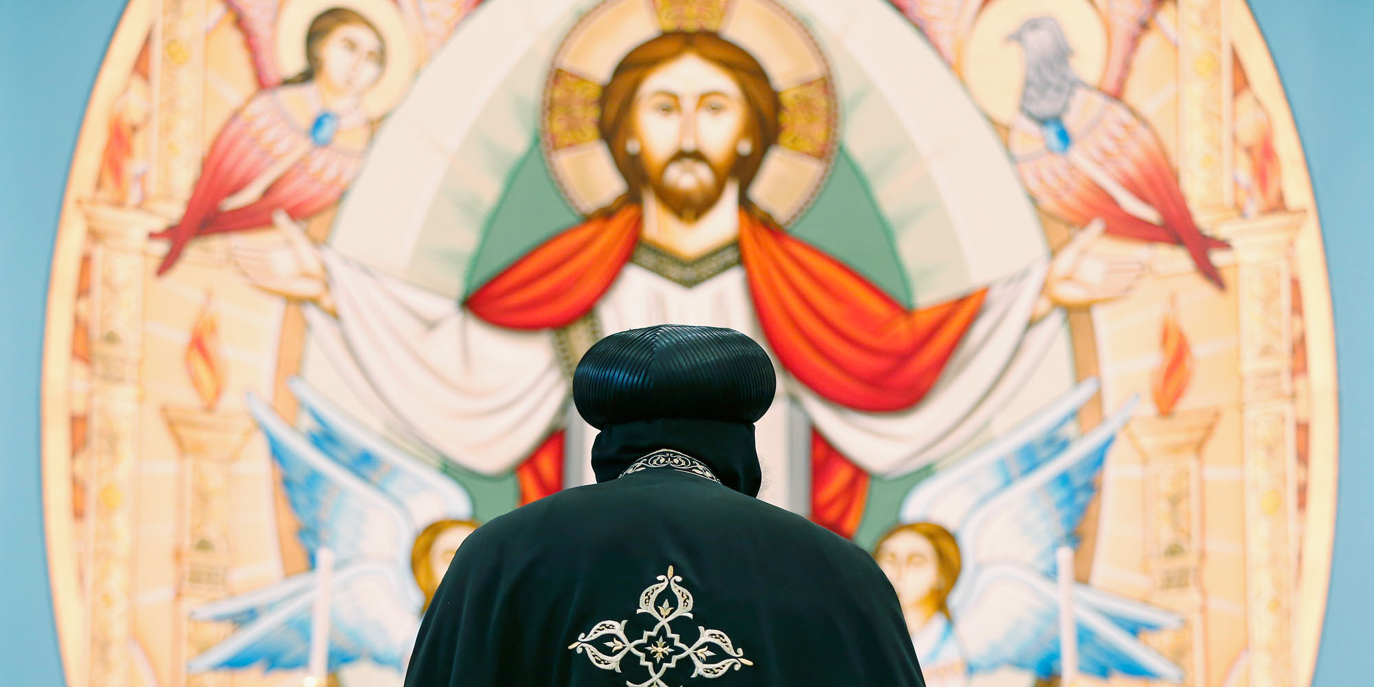 Coptic Pope Tawadros II recites a prayer in the new Cpotic church