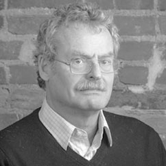 a black and white photo of a man in a suit