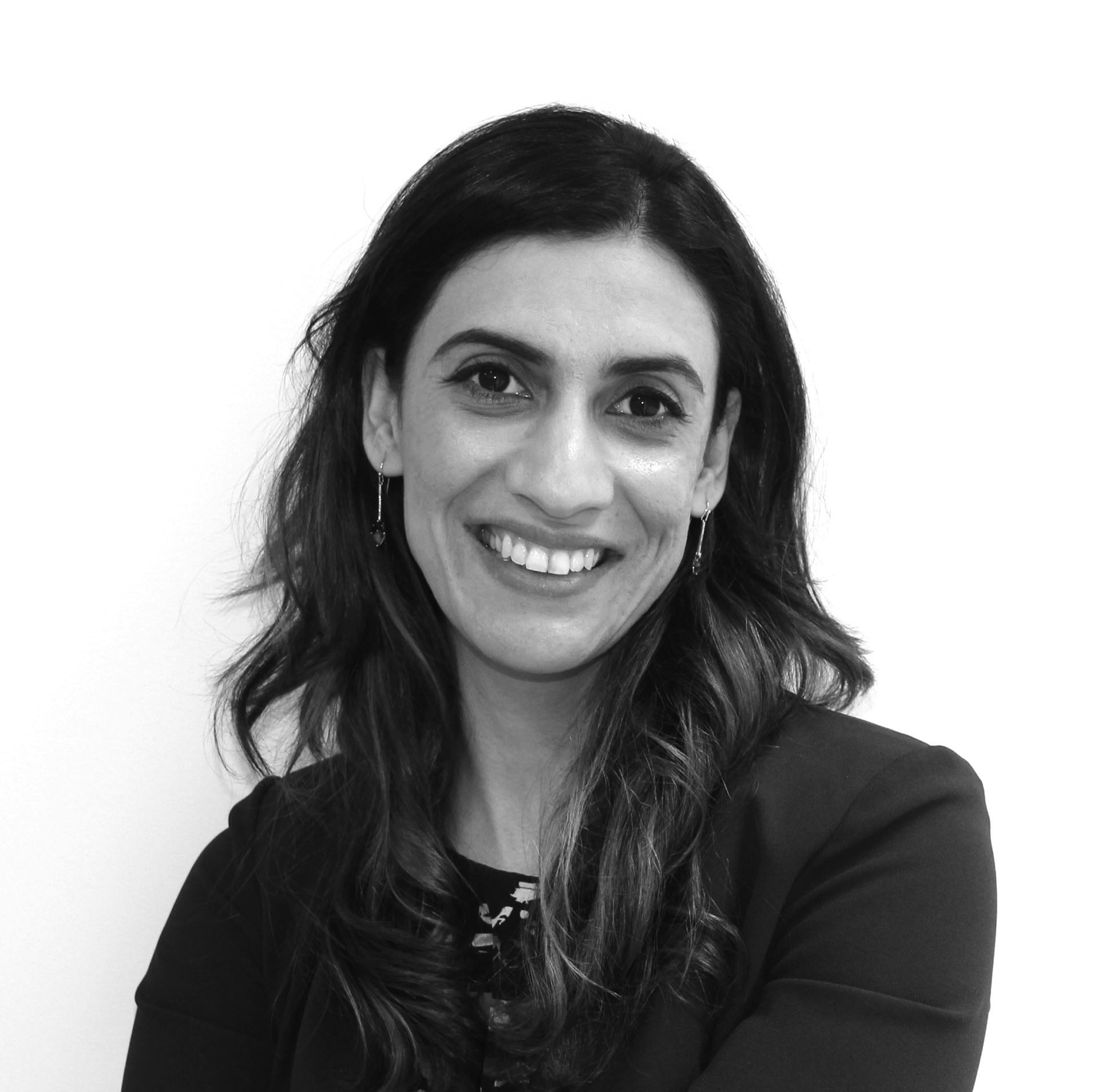 a black and white photo of a smiling woman
