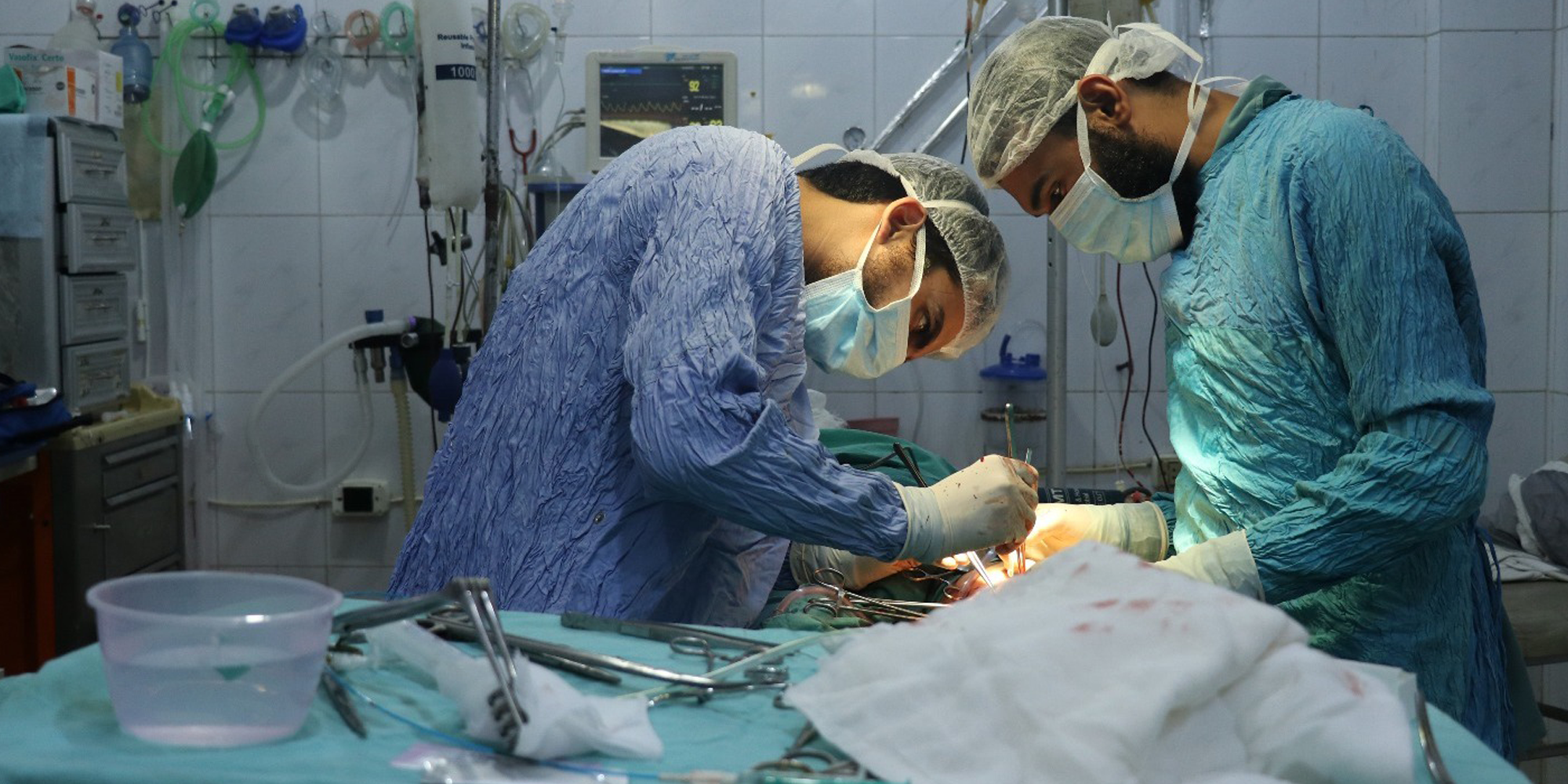 a group of doctors performing surgery in a hospital