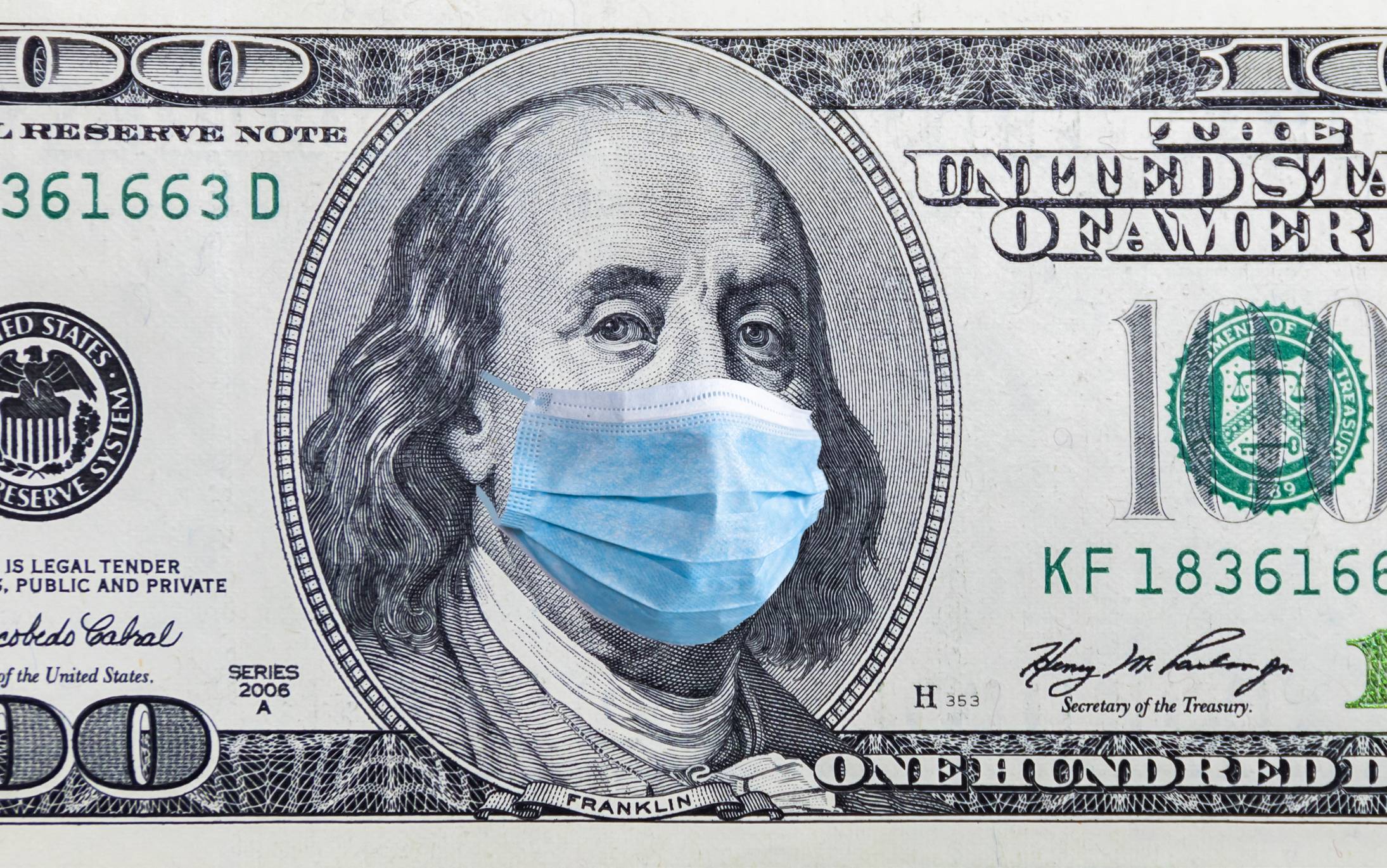 Coronavirus Wuhan. US quarantine, 100 dollar banknote with medical mask. The concept of epidemic and protection against coronavrius.