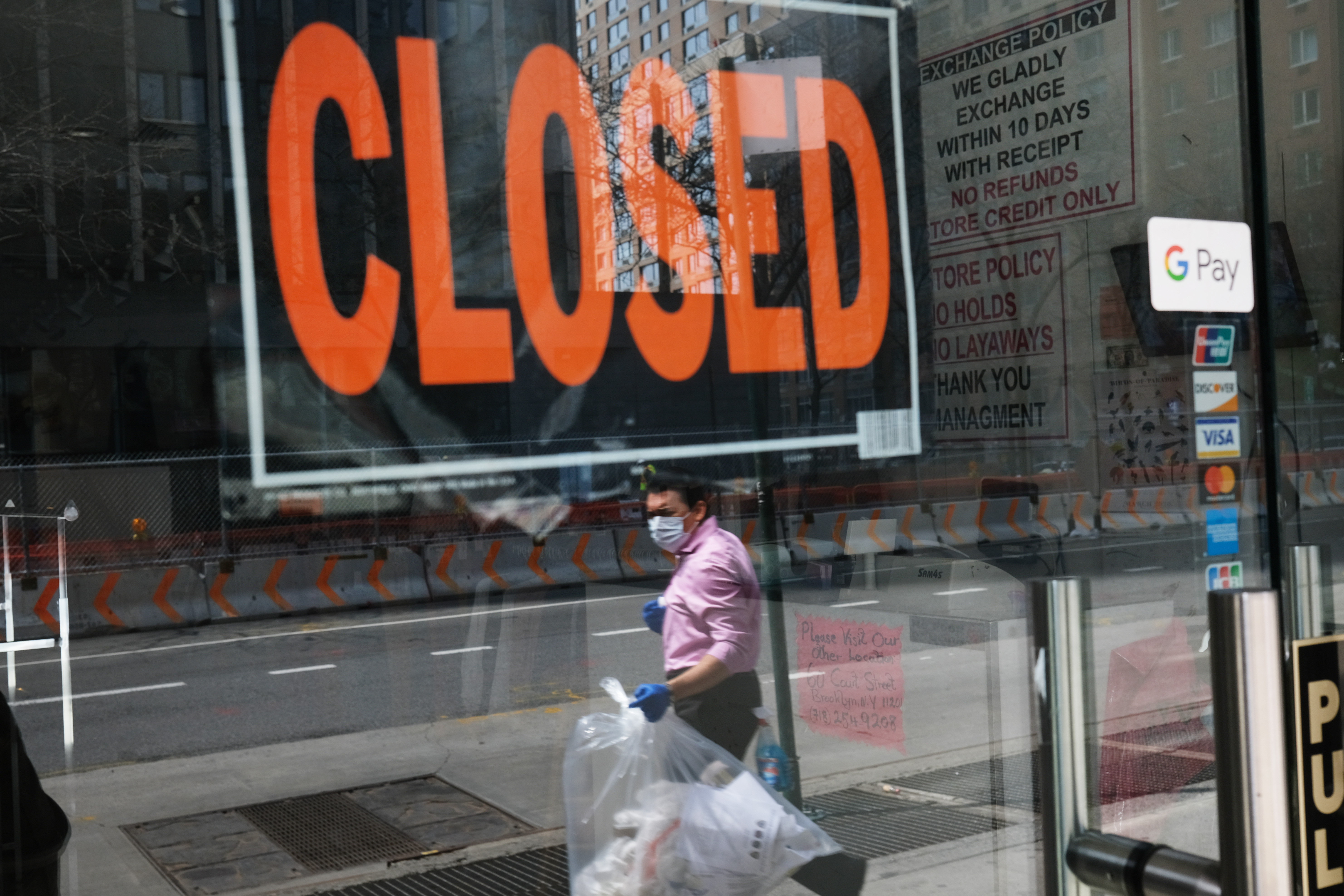 NEW YORK CITY - APRIL 17: A closed sign is displayed in the window of a business in a nearly deserted lower Manhattan on April 17, 2020 in New York City, United States. New York City has been the hardest hit city in America from COVIT-19, with overwhelmed hospitals and a struggling economy.