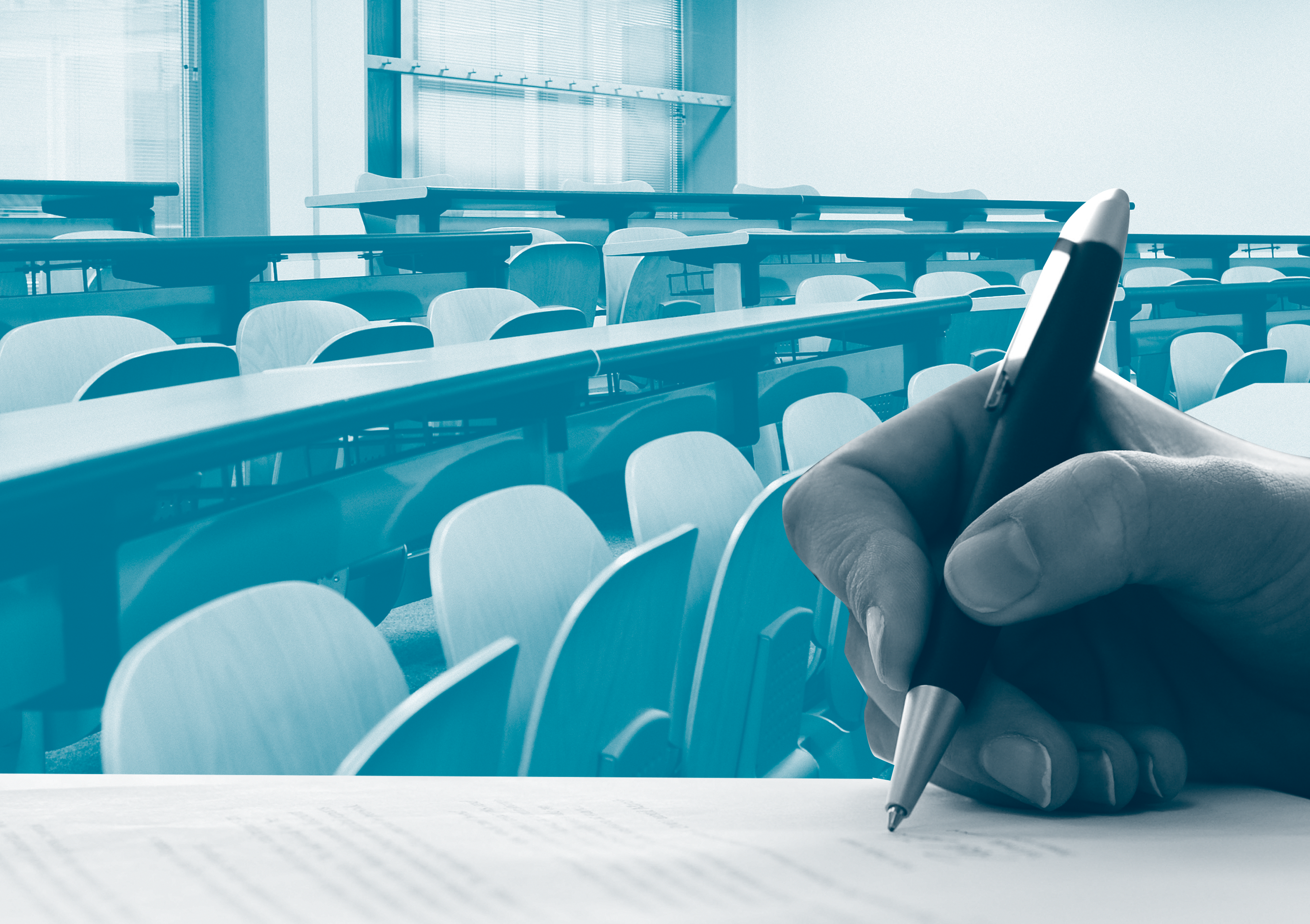 a hand holding a pen and writing on a piece of paper