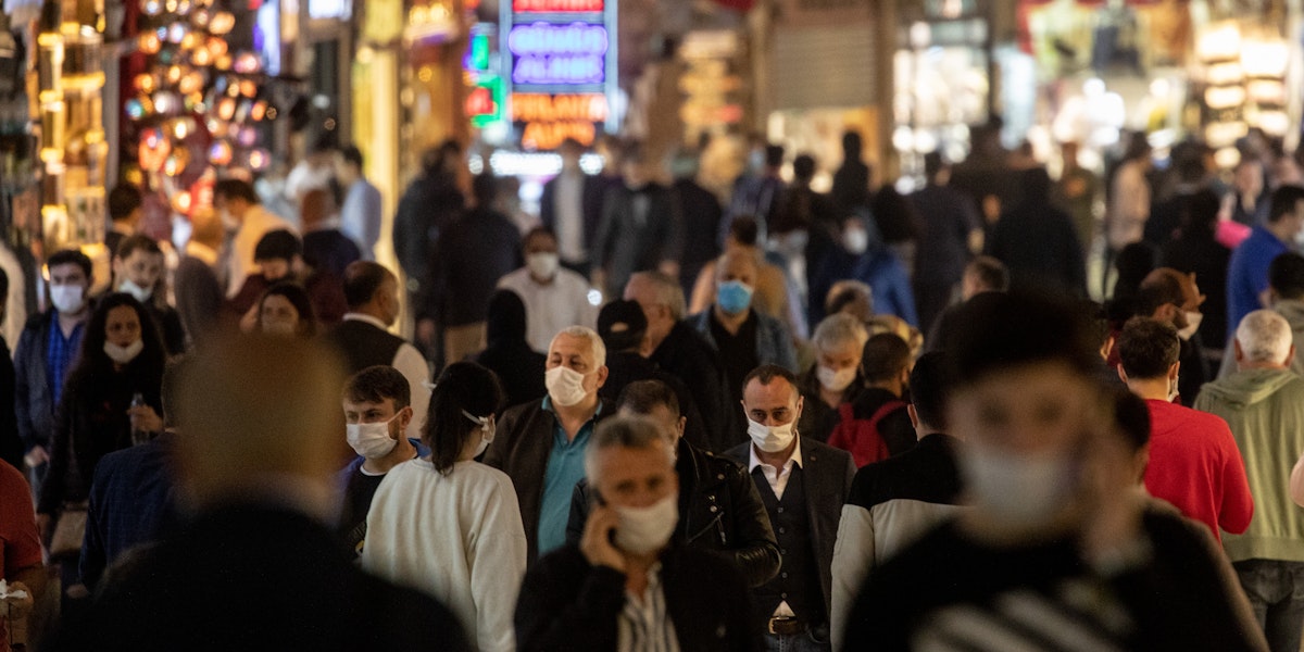 ISTANBUL, TURKEY - JUNE 01: People wearing protective face masks walk in the Grand Bazaar after it reopened after being shut down for weeks due to the spread of the coronavirus on June 01, 2020 in Istanbul, Turkey. As infection rates of the coronavirus continue to drop and after more than a month of weekend lockdowns, Turkey has begun reopening procedures, allowing bars, restaurants and cafes to open under new restrictions for the first time since March 17. Limited domestic flights have restarted and the stay-at-home curfew for citizens under 20 and over 65 has been eased. (Photo by Chris McGrath/Getty Images)