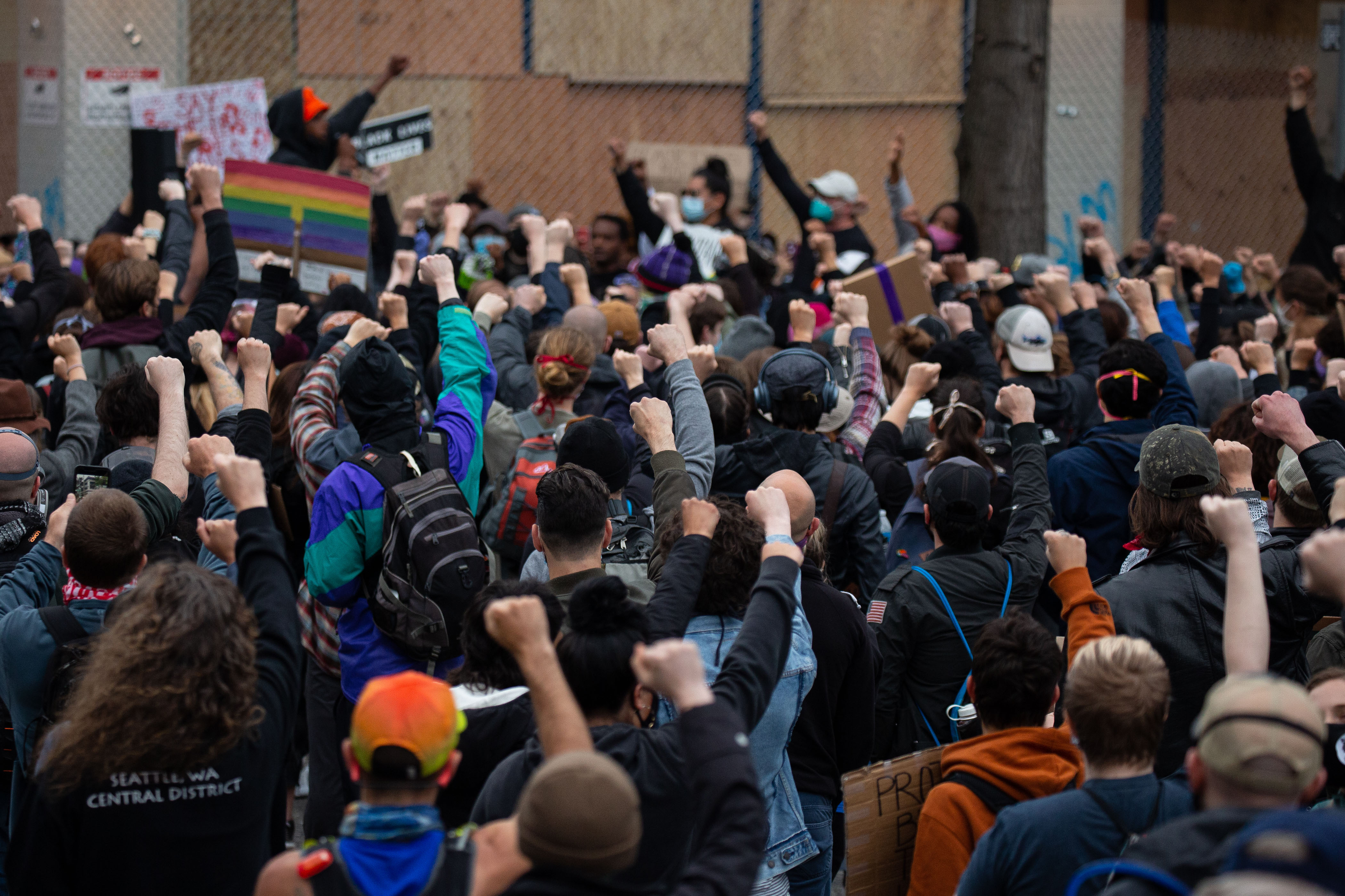 SEATTLE, WA - JUNE 08: Demonstrators hold a rally and teach-in outside of the Seattle Police Departments East Precinct, which has been boarded up and protected by fencing, on June 8, 2020 in Seattle, Washington. Seattle Police and Washington National Guard personnel vacated the area after the previous night saw violent clashes in the vicinity during ongoing Black Lives Matter protests in the wake of George Floyd's death. (Photo by David Ryder/Getty Images)