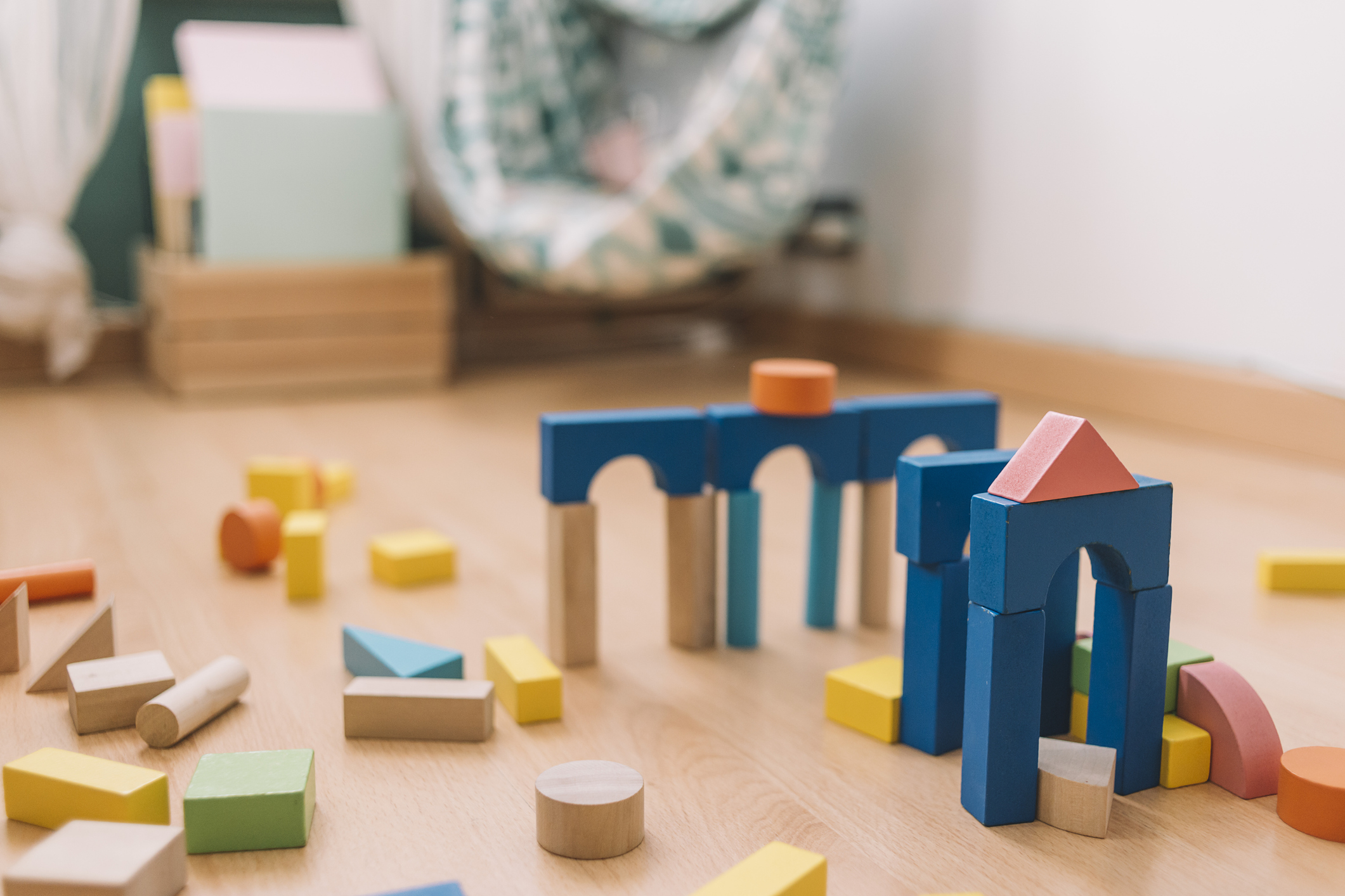 colorful wooden building blocks in the floor at home or kindergarten, educational toys for creative children