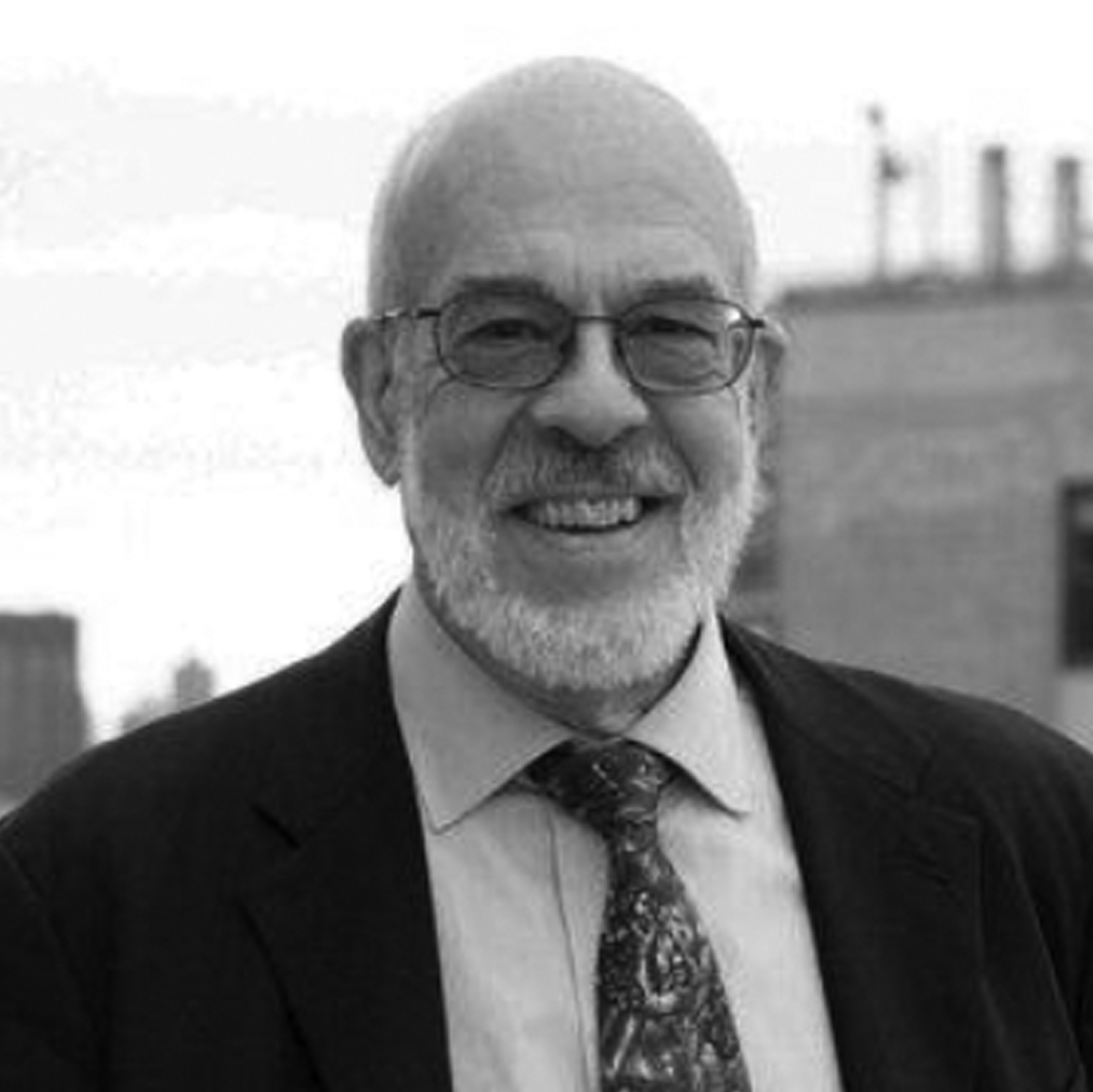 a black and white photo of a man in a suit and tief