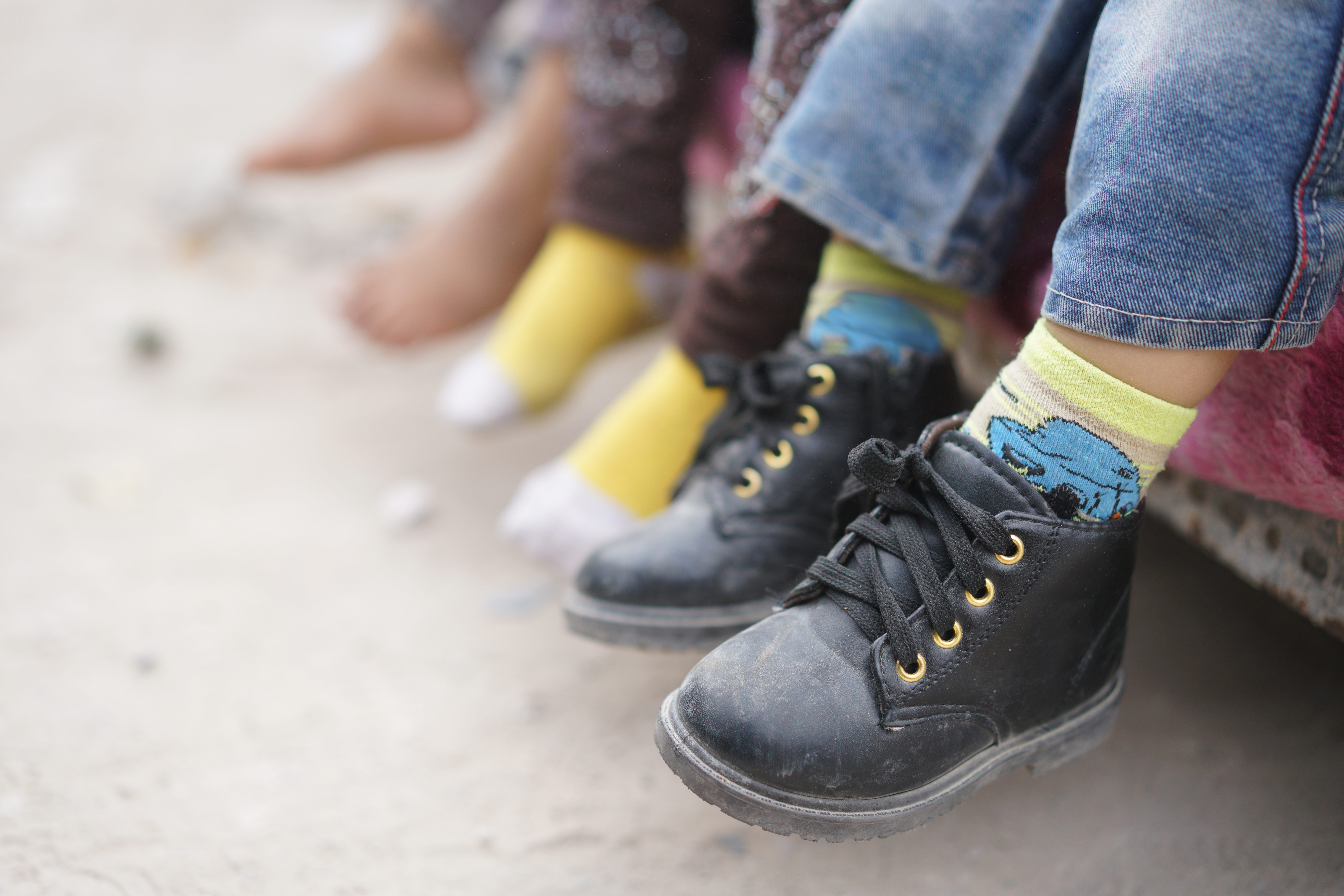 Children feet barefoot and with shoes