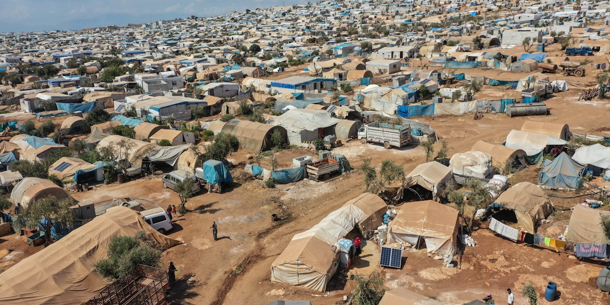 ATMEH, SYRIA - SEPTEMBER 17: A general view of the village of Atmeh which hosts nearly 1 million displaced Syrians near the Syrian-Turkish border in Idlib Province September 17, 2019 in Atmeh, Syria. Turkey’s president, Recep Tayyip Erdogan, is pushing for the creation of an expanded “safe zone” in northern Syria where his government hopes to resettle up to three million Syrian refugees. The United States and Turkey recently started joint patrols of a small buffer zone along the border, but it’s a far cry from the 20-by-300 mile strip proposed by Mr. Erdogan, and no other power involved in the war as agreed to the idea. Turkey has warned that, if it doesn’t receive more international support for the safe zone, it might relax its migration controls and reopen the route for refugees to enter Europe. More than 3.6 million Syrian refugees have settled in Turkey after fleeing the civil war that began in 2011. (Photo by Burak Kara/Getty Images)