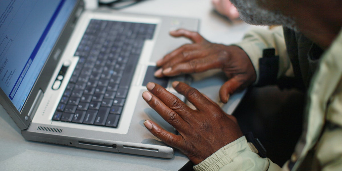 CHICAGO, IL - NOVEMBER 09: John Binns fills out an online application during a job fair hosted by the city of Chicago on November 9, 2012 in Chicago, Illinois. Thousands of people waited in line beginning at 3AM for the job fair which did not open the doors until 9AM. When the doors opened the line was about a half-mile long. (Photo by Scott Olson/Getty Images)