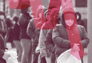 Photograph of people standing in line in the cold