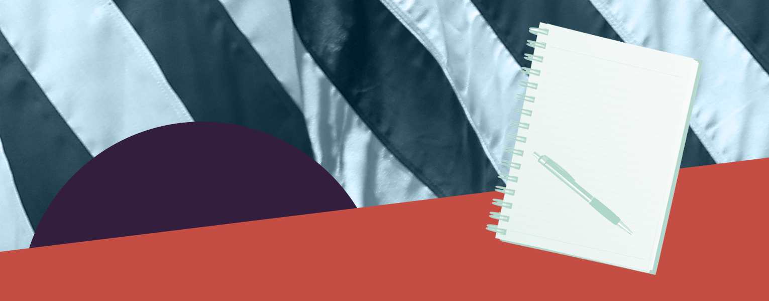 A notebook in front of a green and white flag