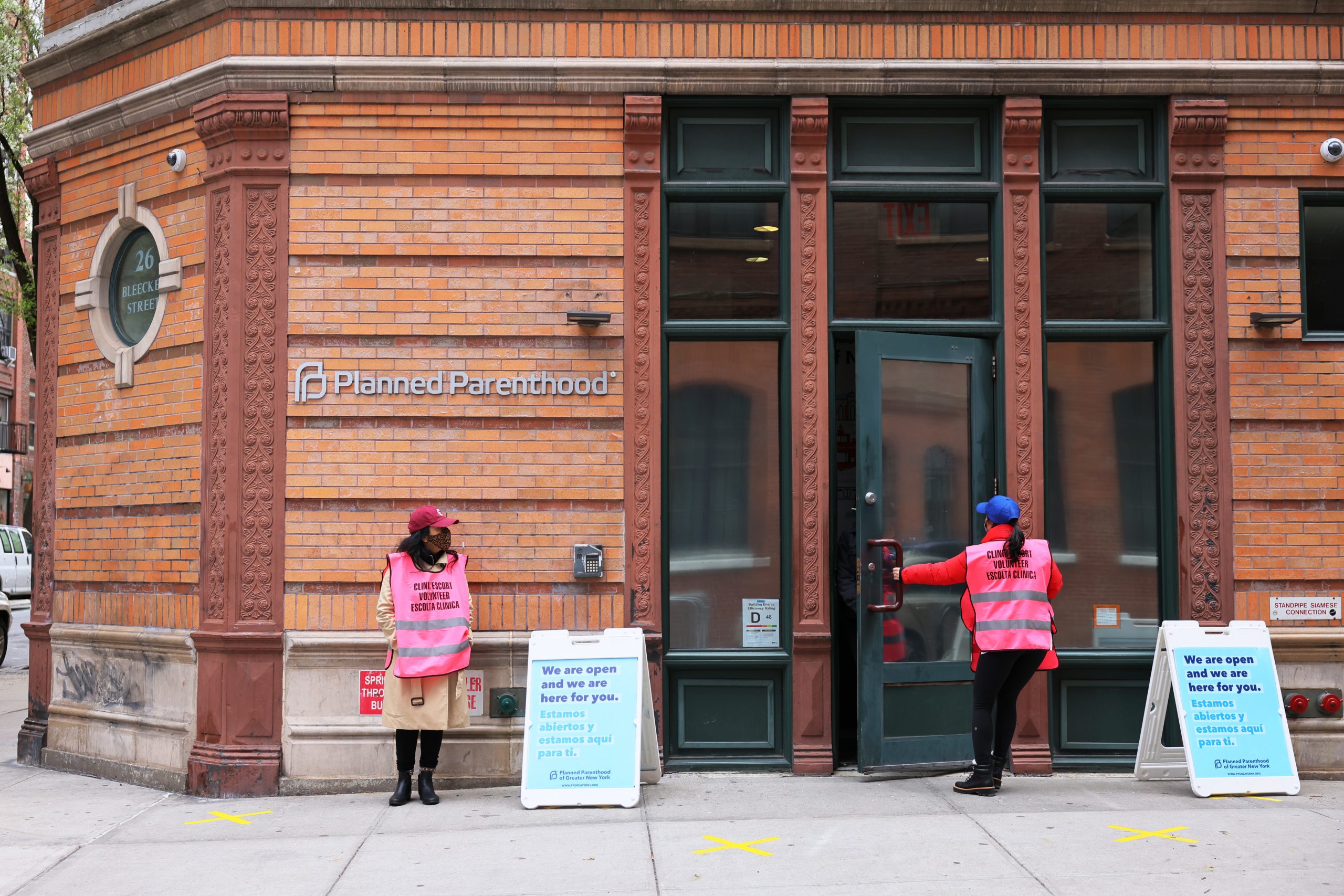 NEW YORK, NEW YORK - APRIL 16: Clinic escort volunteers stand outside of the Planned Parenthood in the Financial District neighborhood of Manhattan on April 16, 2021 in New York City. The Biden administration's Department of Health and Human Services has begun the process of undoing a Trump administration policy,  known as Title X, that stripped federal family-planning dollars from clinics that refer patients for abortions, a move that drove Planned Parenthood to withdraw from the program.  (Photo by Michael M. Santiago/Getty Images)