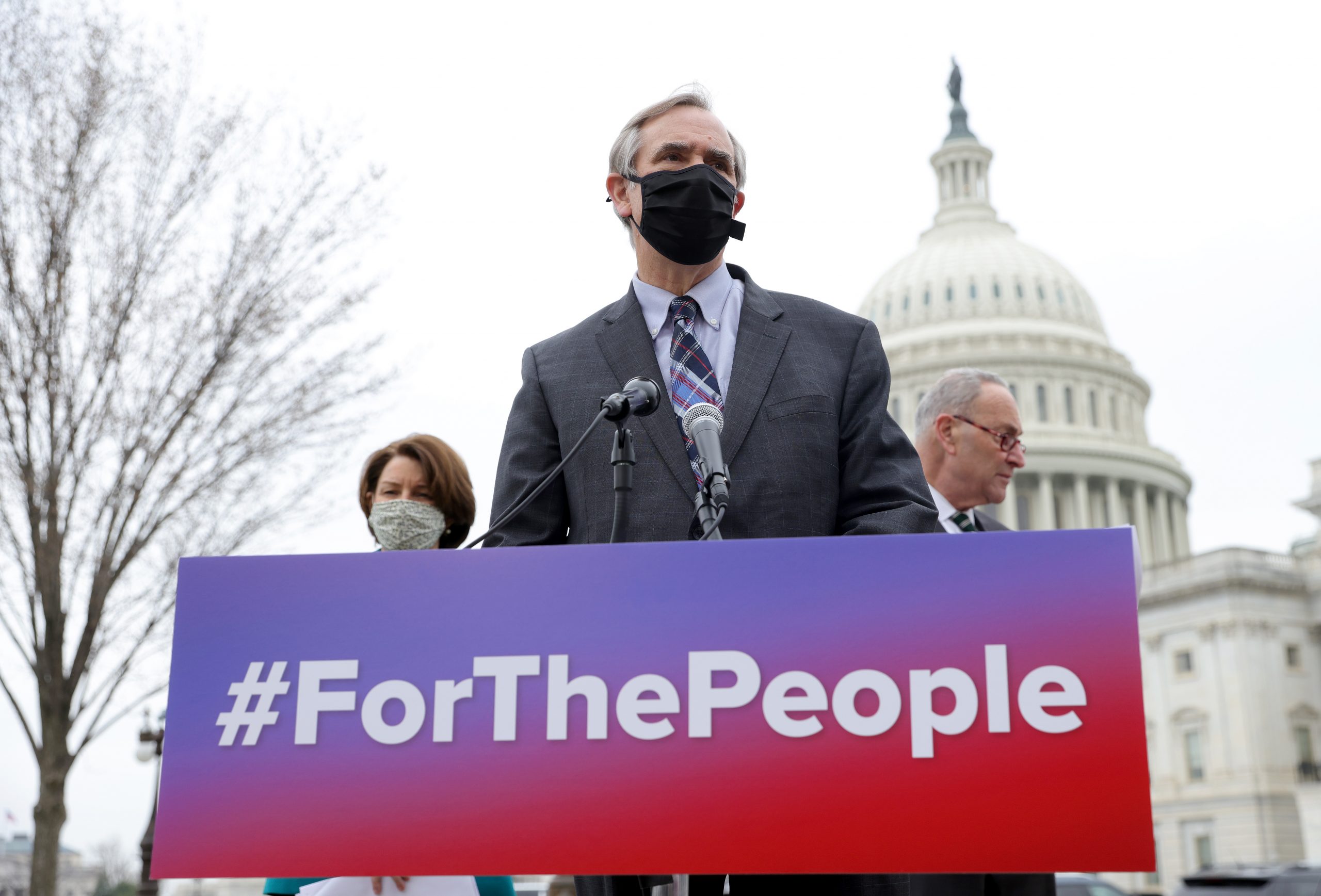 WASHINGTON, DC - MARCH 17:  Sen. Jeff Merkley (C) (D-OR), Senate Majority Leader Chuck Schumer (R) (D-NY),  and Sen. Amy Klobuchar (L) (D-MN) announce the introduction of S.1., the ‘For the People’ Act, outside the U.S. Capitol March 17, 2021 in Washington, DC. The “For the People Act” aims to make it simpler for eligible Americans to vote in elections. (Photo by Win McNamee/Getty Images)