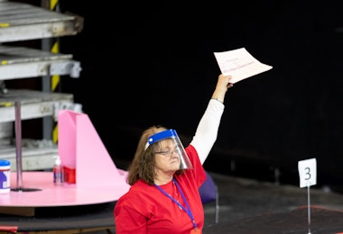 PHOENIX, AZ - MAY 01: A contractor working for Cyber Ninjas, who was hired by the Arizona State Senate, works to recount ballots from the 2020 general election at Veterans Memorial Coliseum on May 1, 2021 in Phoenix, Arizona. The Maricopa County ballot recount comes after two election audits found no evidence of widespread fraud in Arizona. (Photo by Courtney Pedroza/Getty Images)