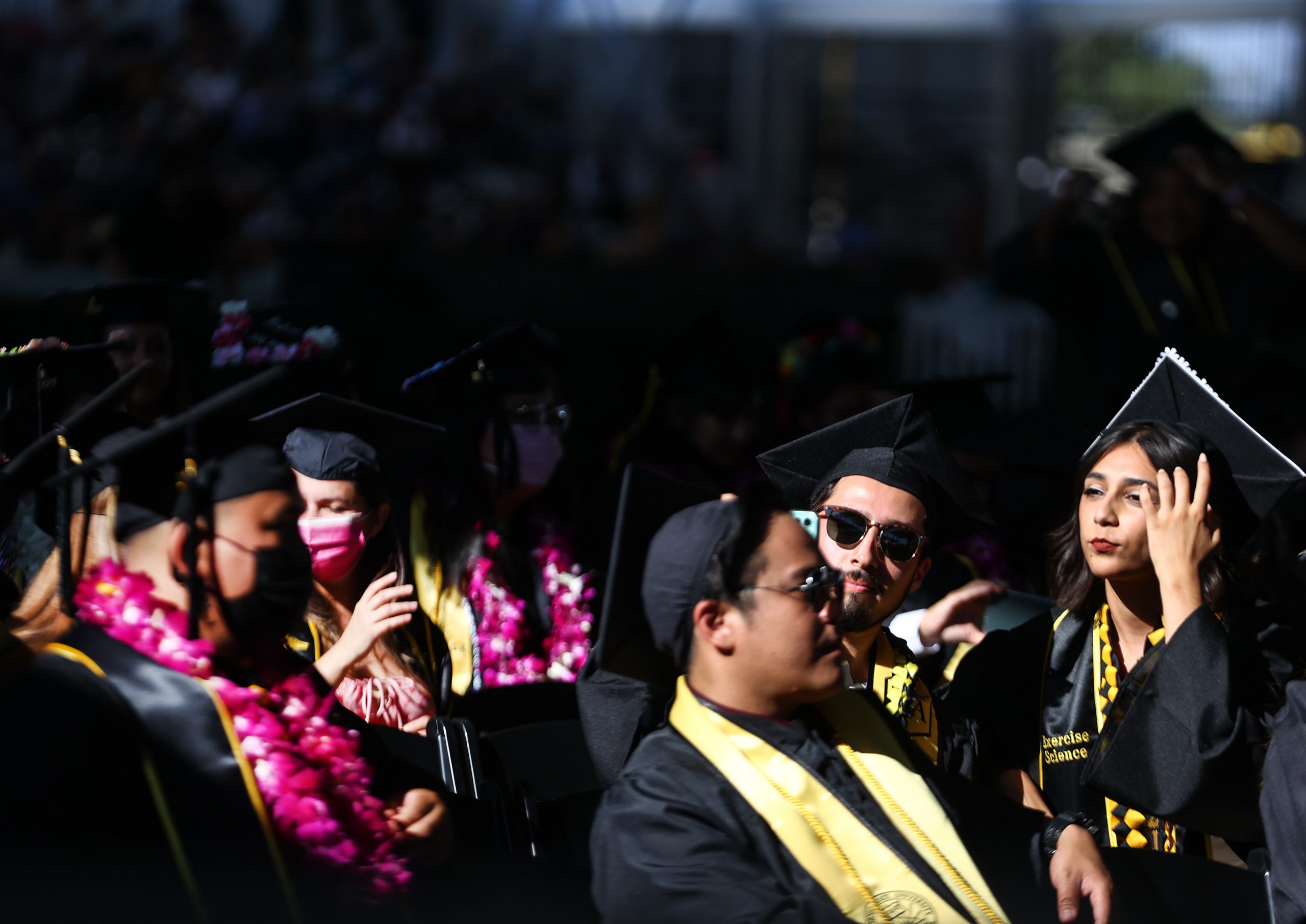 LOS ANGELES, CALIFORNIA - JULY 27: Cal State Los Angeles graduates sit at their commencement ceremony which was held outdoors beneath a tent on campus on July 27, 2021 in Los Angeles, California. Commencement ceremonies for graduates from the classes of 2021 and 2020 are being held outdoors over seven days following delays due to the COVID-19 pandemic.  (Photo by Mario Tama/Getty Images)