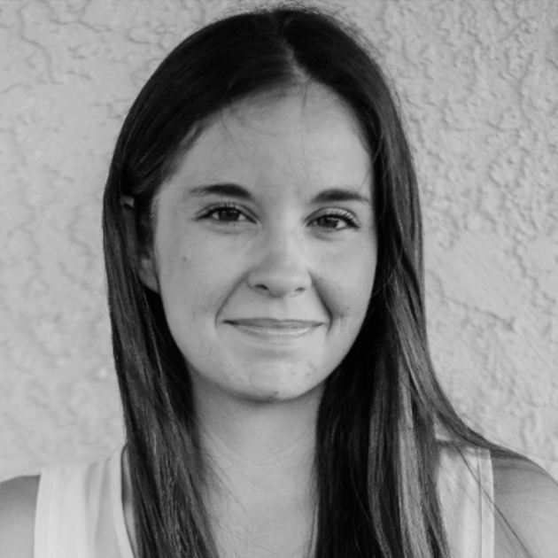 a black and white photo of a woman smiling