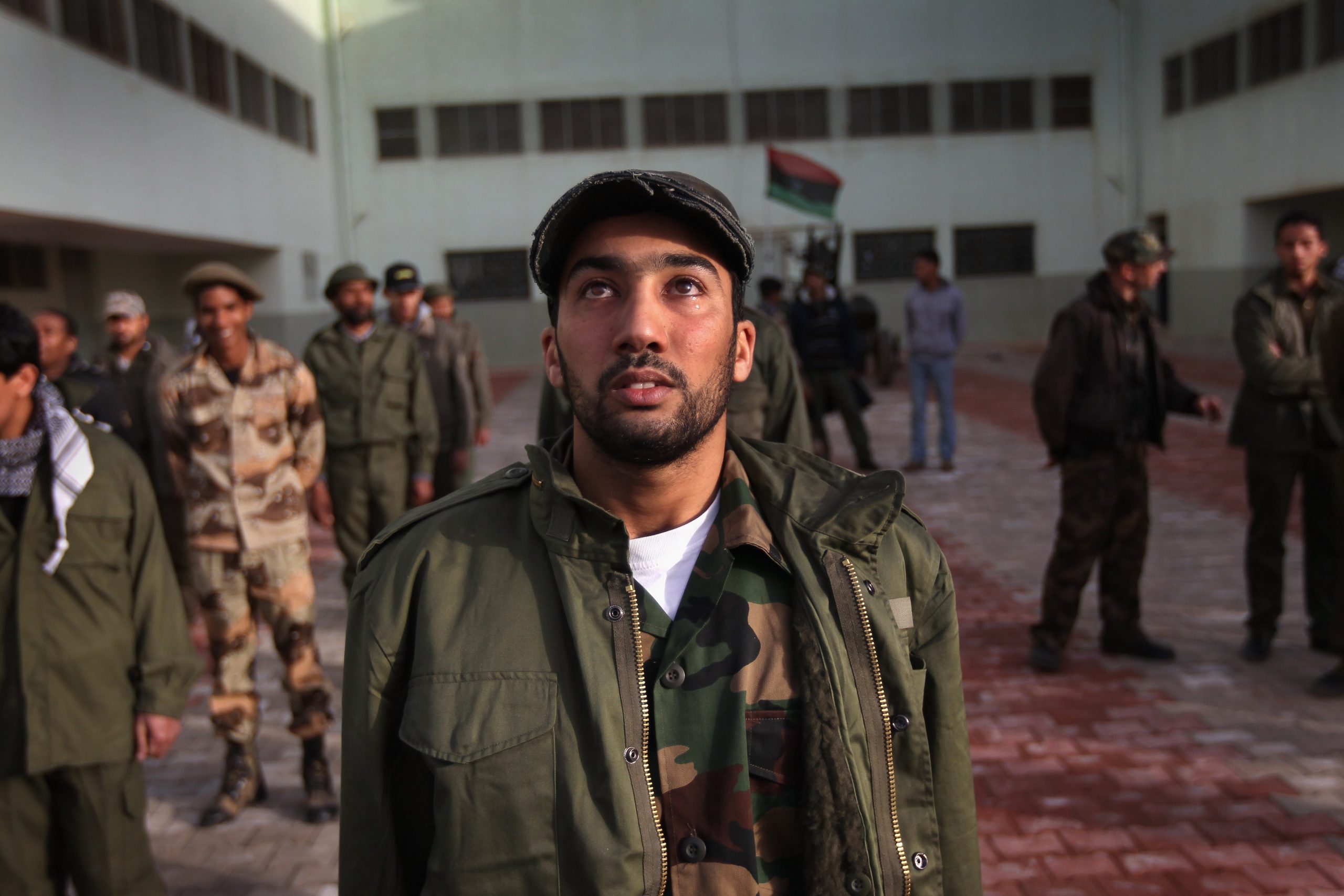 BENGHAZI, LIBYA - MARCH 01:  A rebel recruit tears up during his first day of military training at a rebel militia center on March 1, 2011 in Benghazi, Libya. Supporters of the Libyan opposition, which controls Benghazi and most of eastern Libya, have been eager to join militia groups, which have been fighting the forces of President Muammar Gaddafi to the west near the capitol Tripoli.  (Photo by John Moore/Getty Images)