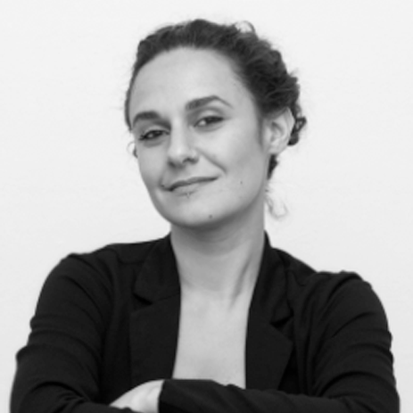 a black and white photo of a woman with her arms crossed