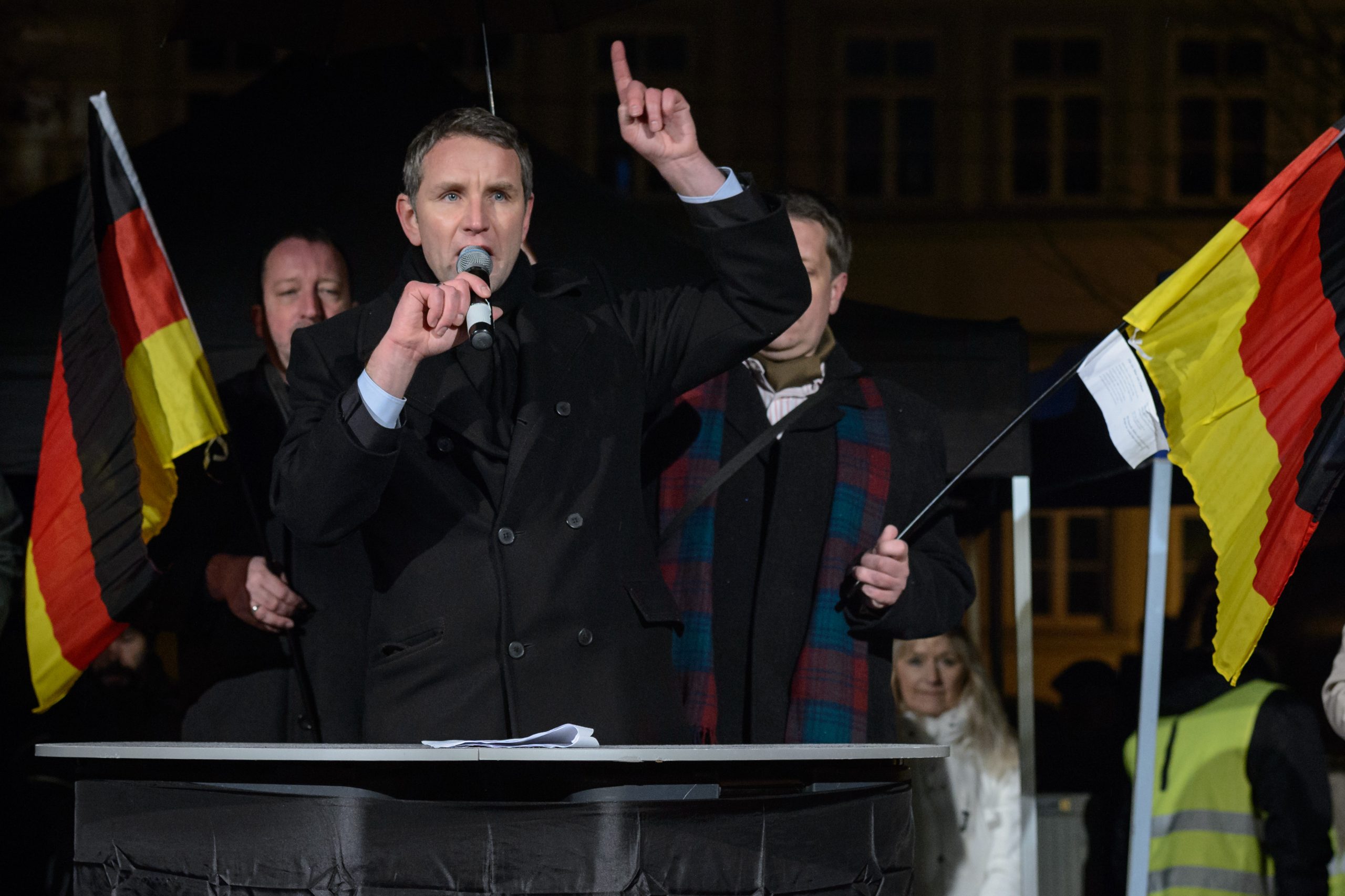 ERFURT, GERMANY - JANUARY 13: Bjoern Hoecke, head of the AfD (Alternative fuer Deutschland, or Alternative for Germany) in Thuringia, speaks to supporters at the first AfD Thuringia rally since the Cologne sex attacks on January 13, 2016 in Erfurt, Germany. Hoecke, who is on the far-right wing of the AfD, is demanding an immediate closure of Germany's borders to refugees and the expulsion of foreigners with criminal records. Over 500 women have filed charges including molestation, in some cases robbery and even rape following the gathering of hundreds of North African men, many of them were from Morocco and Algeria, at Cologne's Hauptbahnhof main railway station on New Year's Eve. The incident has caused heated discussion in Germany over the government's open-door policy for refugees. In 2015 Germany registered 1.1 million new migrants and refugees. (Photo by Jens Schlueter/Getty Images)