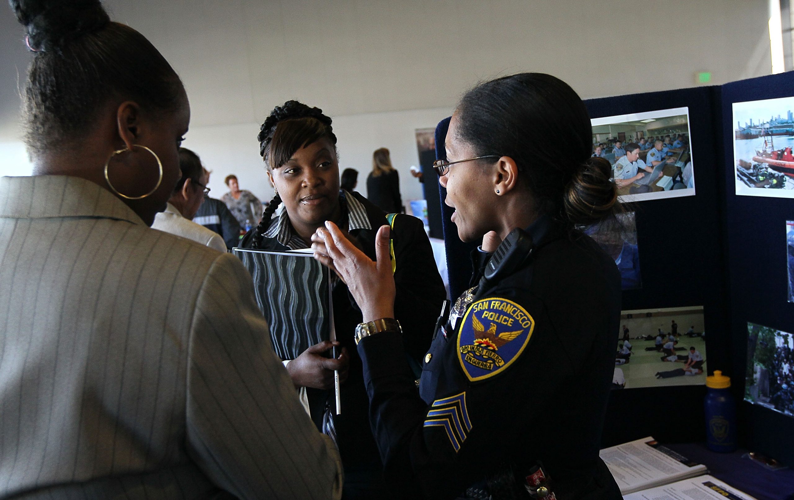 SAN FRANCISCO - MAY 12:  A San Francisco police department recruiter talks with job seekers during a job fair held by the California Employment Development Department and the San Francisco Veterans Employment Committee May 12, 2010 in San Francisco, California. Hundreds of job seekers attended the one-day job fair as the national unemployment rate sits at 9.9 percent.  (Photo by Justin Sullivan/Getty Images)