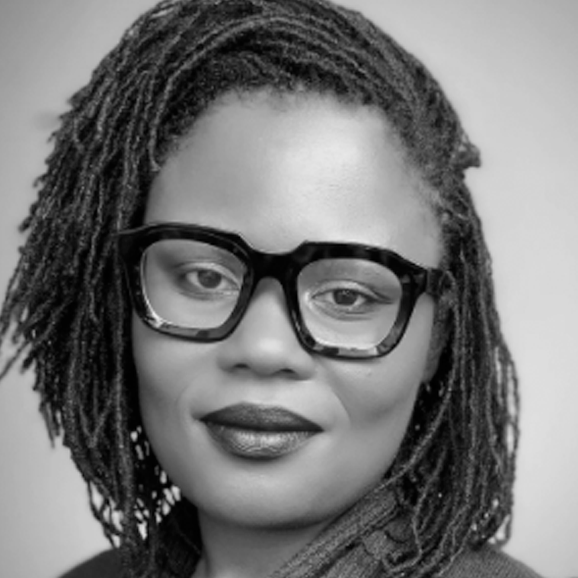 a black and white photo of a woman wearing glasses