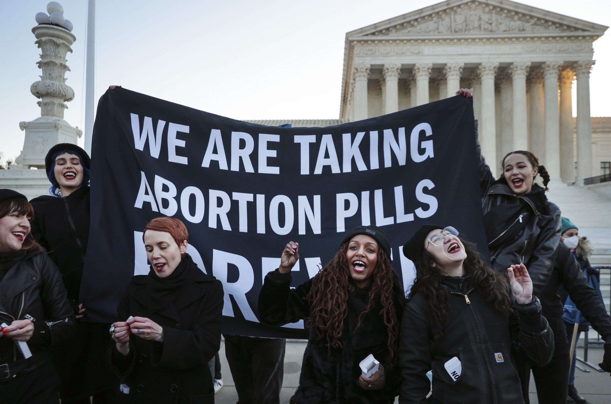 WASHINGTON, DC - DECEMBER 01: Protesters, demonstrators and activists gather in front of the U.S. Supreme Court as the justices hear arguments in Dobbs v. Jackson Women's Health, a case about a Mississippi law that bans most abortions after 15 weeks, on December 01, 2021 in Washington, DC. With the addition of conservative justices to the court by former President Donald Trump, experts believe this could be the most important abortion case in decades and could undermine or overturn Roe v. Wade. (Photo by Chip Somodevilla/Getty Images)