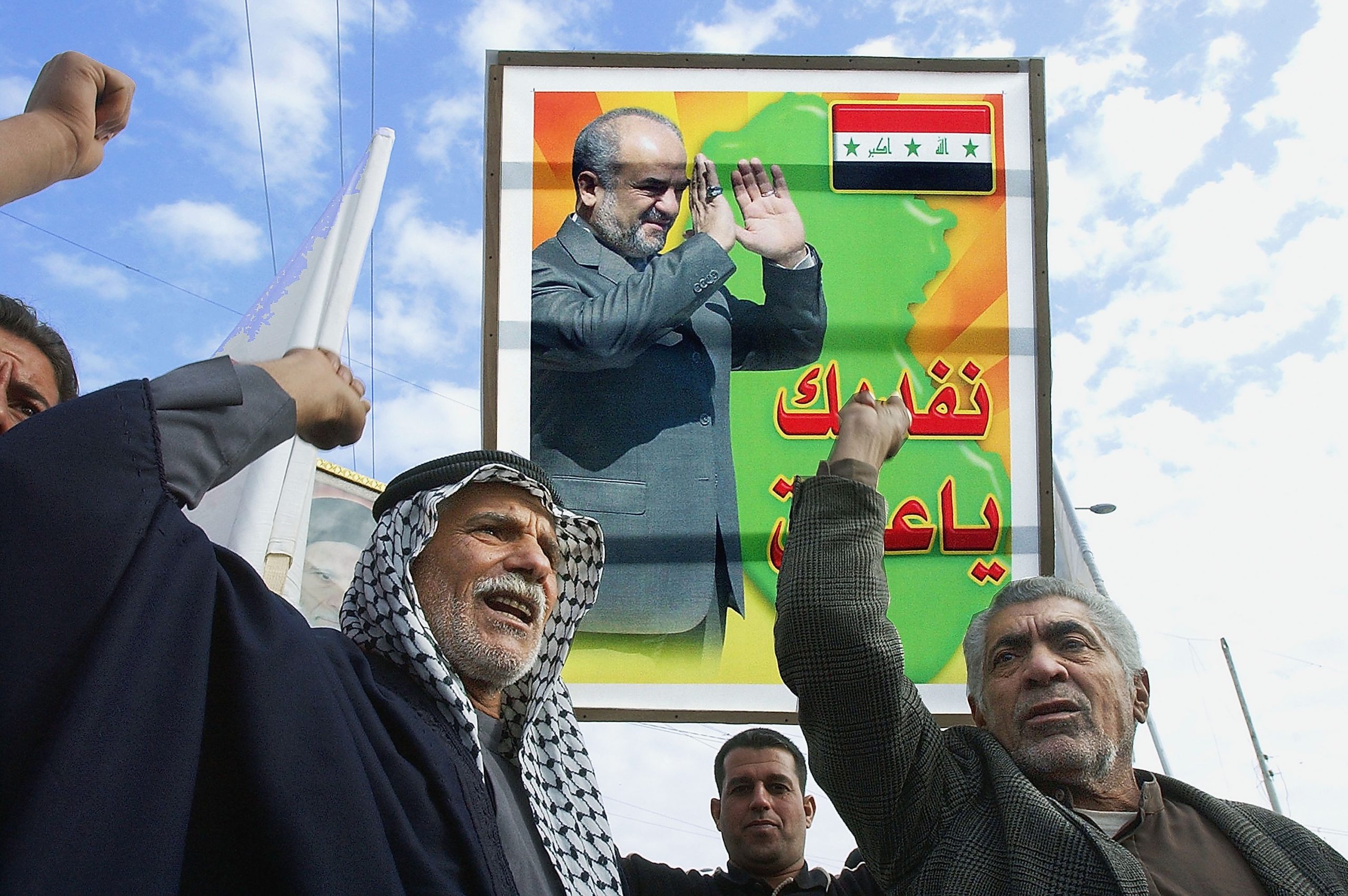 BAGHDAD, IRAQ - DECEMBER 25: Iraqi Shiites carry a picture of Iraq's Prime Minister Ibrahim al-Jaafari during a demonstration on December 25, 2005 in Baghdad, Iraq. Iraqi shiites shout slogans in favour of the results of the elections
 during a demonstration  in al-Sadr city eastren of Baghdad.
 (Photo by Wathiq Khuzaie /Getty Images)