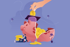 A college graduate leaning against a cracked, broken piggy bank.